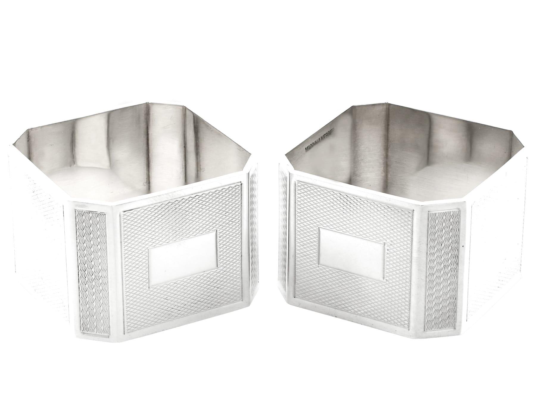 An exceptional, fine and impressive pair of antique George VI English sterling silver Art Deco napkin rings, boxed, part of our dining silverware collection.

These exceptional antique English sterling silver napkin rings have a square form with