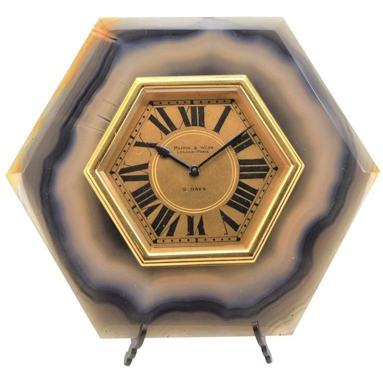 Factory / house: Mappin & Webb 
Style / reference: Art Deco / Agate stone Easel desk clock 
Movement / caliber: 15 Jewels Swiss Made / eight days / manual winding
Dial / hands: Original Roman numerals / Blued steel spade and pointer