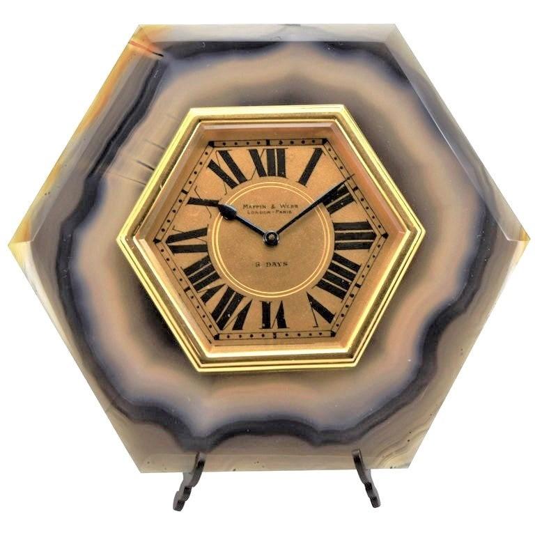 FACTORY / HOUSE: Mappin & Webb 
STYLE / REFERENCE: Art Deco / Agate Stone Easel Desk Clock 
MOVEMENT / CALIBER: 15 Jewels Swiss Made / Eight Days / Manual Winding
DIAL / HANDS: Original Roman Numerals / Blued Steel Spade and Pointer