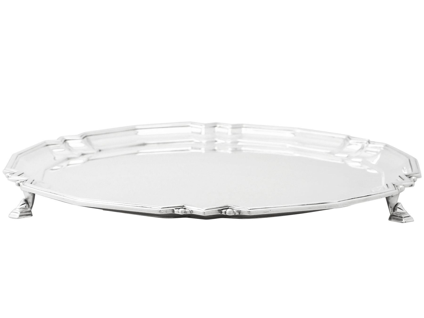 An exceptional, fine and impressive antique Edward VIII English sterling silver salver made in the Art Deco style; an addition to our silver dining collection

This exceptional antique Edward VIII English sterling silver salver has a circular shaped