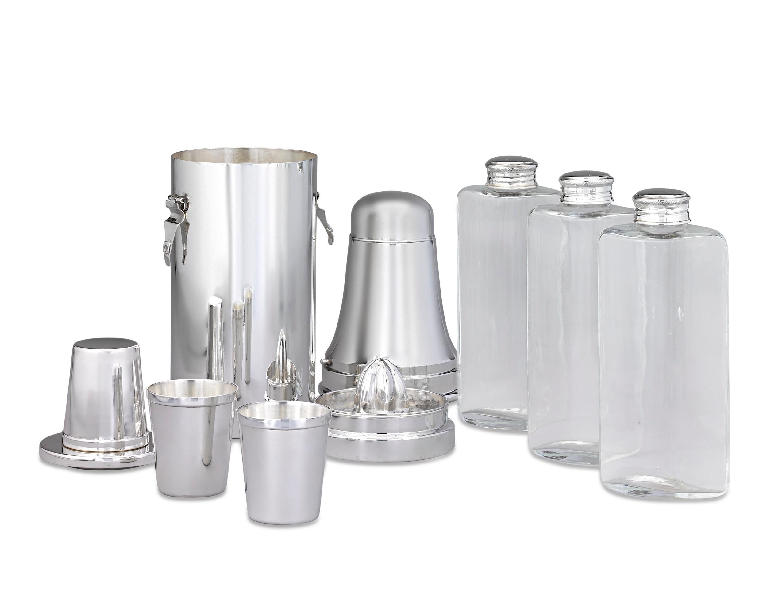 A beautiful bar accessory dating to the golden age of the cocktail, this wonderful traveling cocktail set was made by Mappin & Webb and features everything needed to craft and serve the perfect beverage. The entire set is made of silverplate and