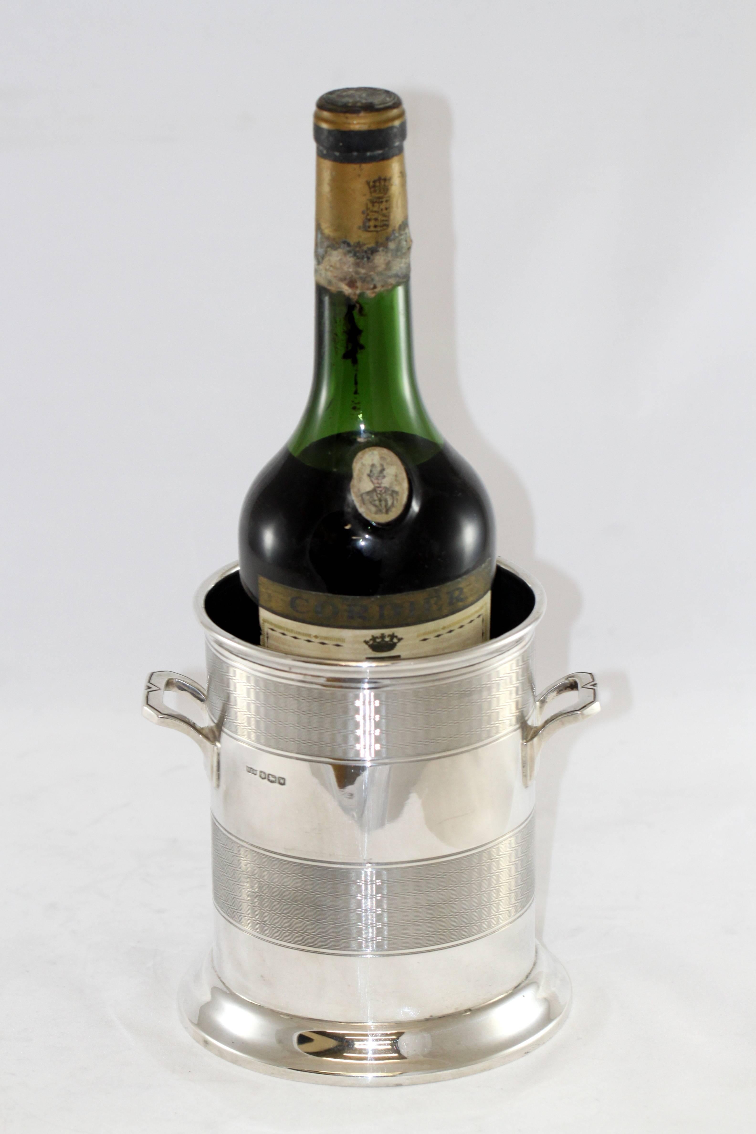 Vintage sterling silver champagne / wine cooler
Maker: Mappin & Webb
Made in Sheffield 1964
Fully hallmarked.

Dimensions: 
Size: 15.2 x 13.4 x 14.8 cm
Weight: 505 grams

Condition: Surface wear and tear from general usage, interior of the