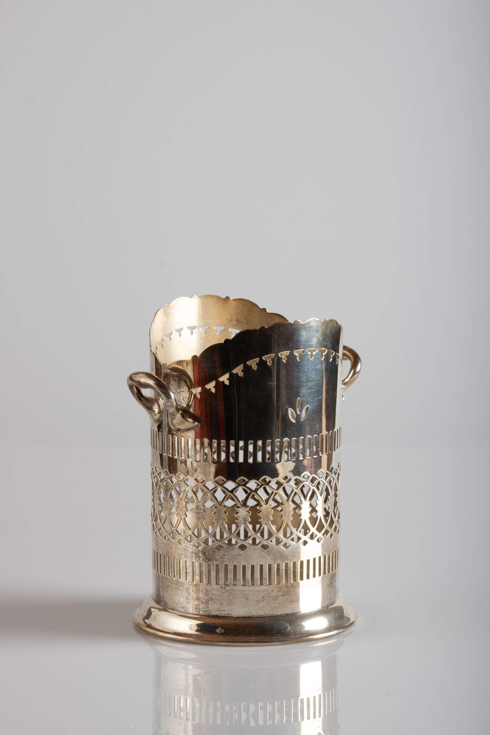 Finely decorated Sheffield plate bottle holder, from the marks at the bottom we see that it was produced in the beginning of the 20th century in London.