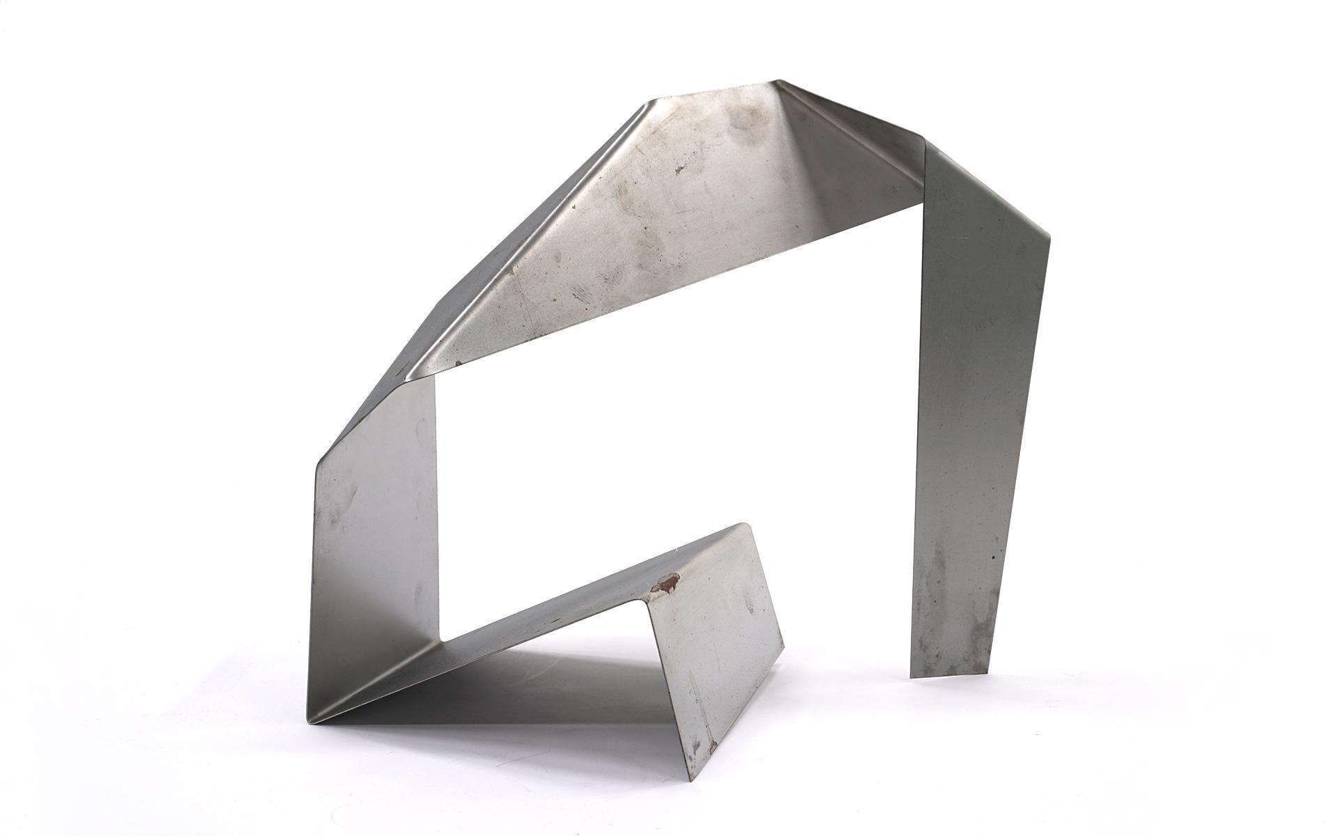 This is a model for a large sculpture made by artist James Bearden. A great table top sculpture in it's own right. Hand signed by the artist. Made of bent and angled metal with a silver finish. Free shipping in the continental US.