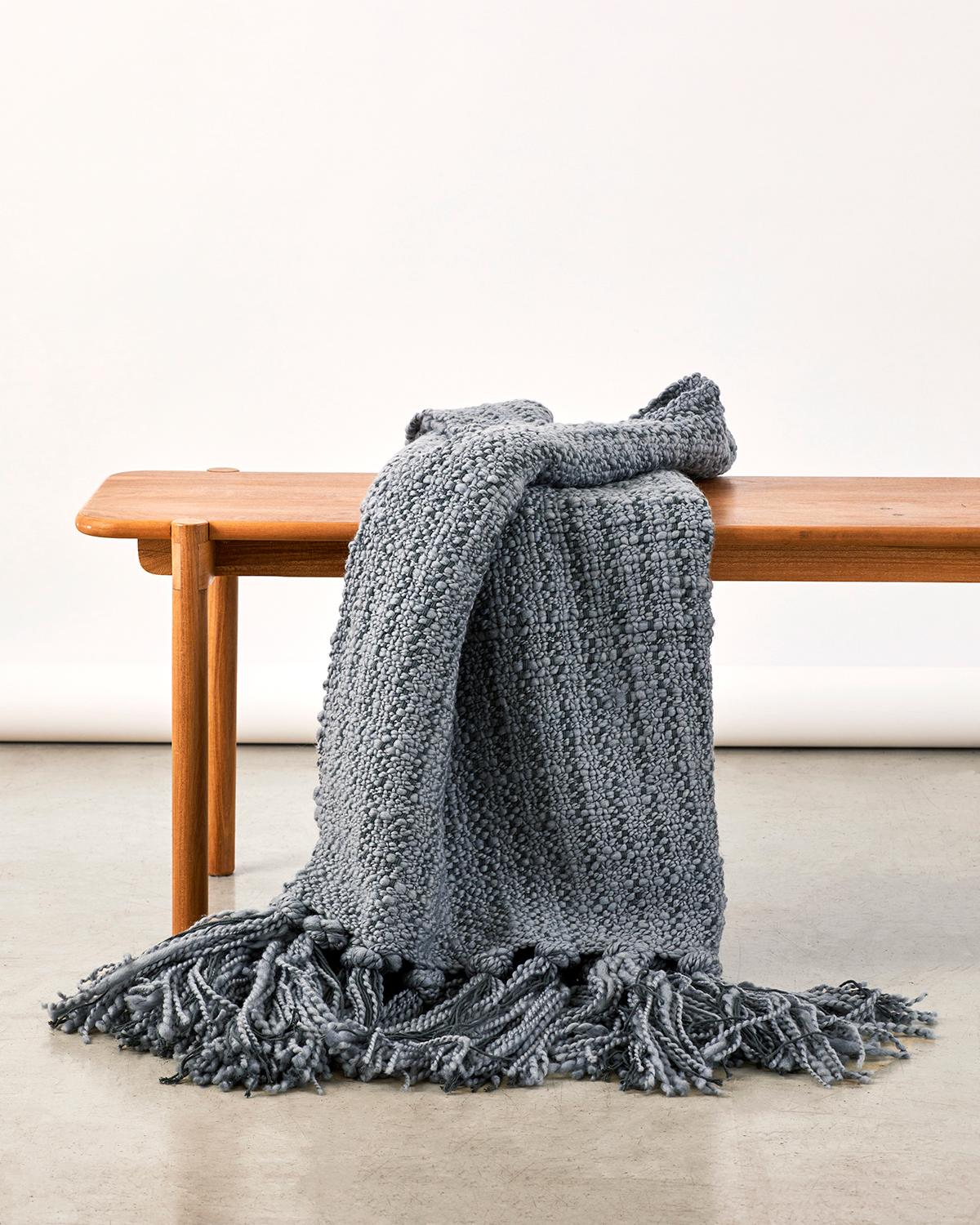 An ultra soft cotton throw to cozy up with on cold winter nights. Indulge in the quiet luxury of our Mar Merino Wool and Cotton Throw Blanket. Handwoven from a blend of merino wool and cotton, this throw boasts a rustic yet modern design with a soft