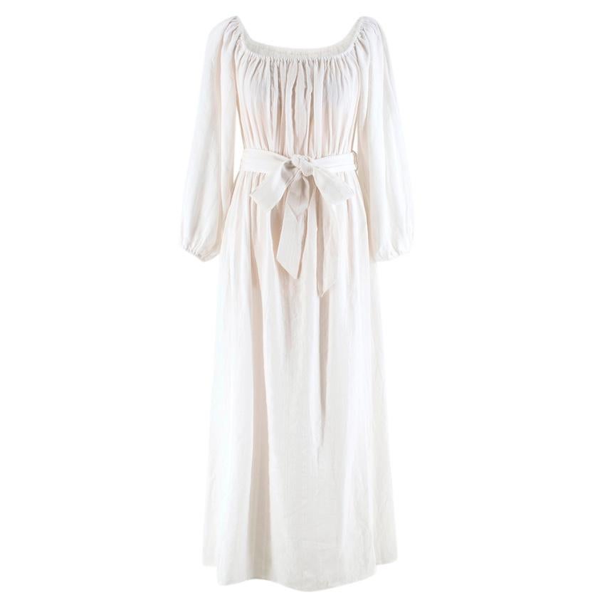 Mara Hoffman White Malika Dress 

- Off the shoulder, on the shoulder; knotted or tied into a bow at the waist
- Balloon-like sleeves
- Waist-tie 
- Elasticated Waist, Cuffs and Neckline 
- Textured Cotton 

Machine Washable 

100% Organic Cotton