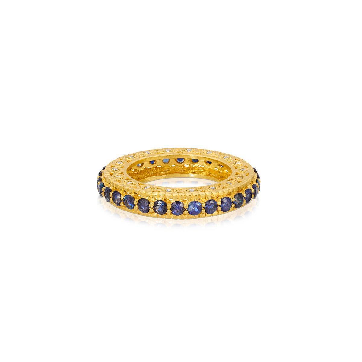 The Mara Sapphire Eternity band... fully set with sparkling Sapphires featuring an opulent filigree depth studded with Diamonds. 

- Natural Sapphires weight approx 2.46 Carats.
- White Diamonds weight approx .36 Carats.
- Set in 22 Karat Gold