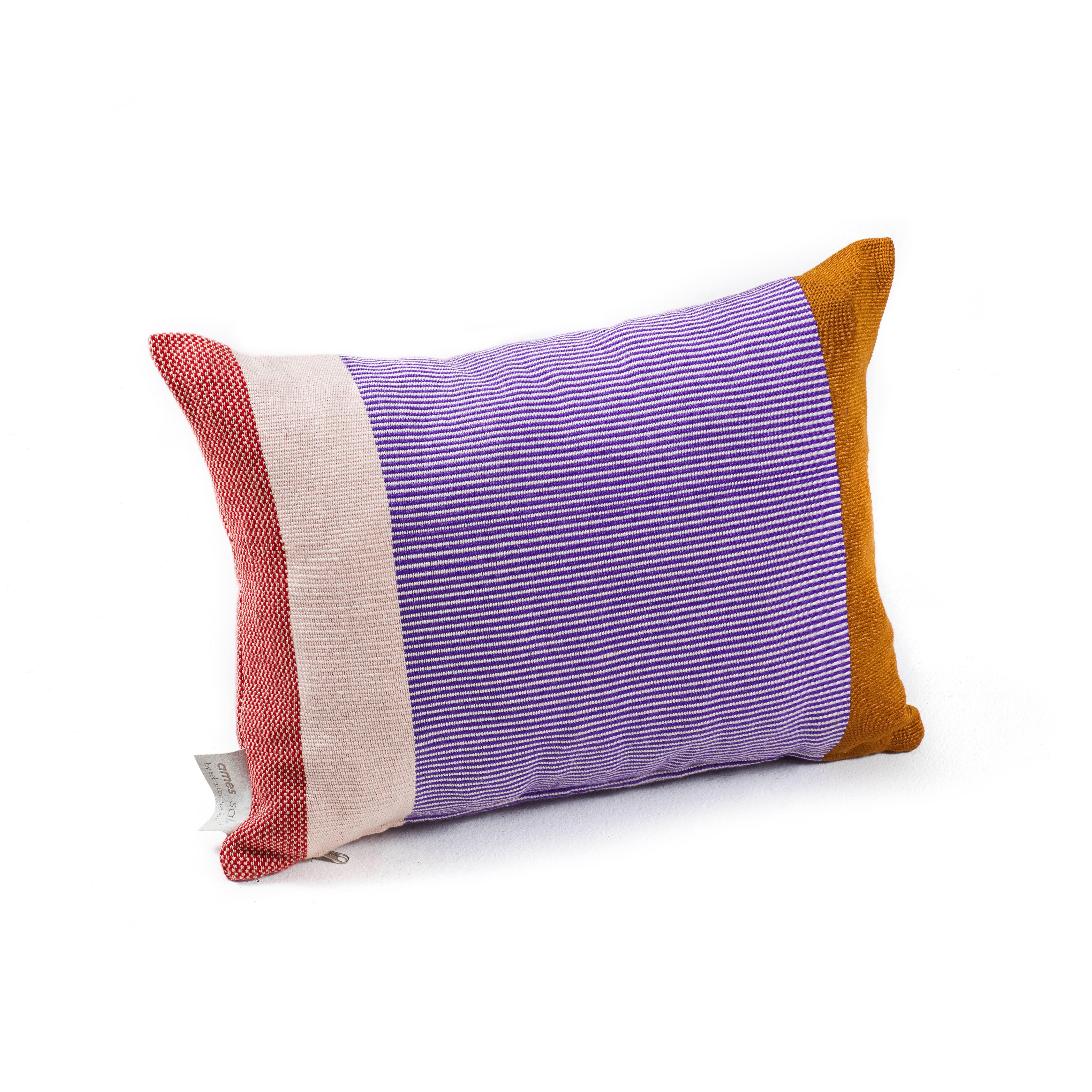 Maraca pillow 2 by Sebastian Herkner
Materials: 100% cotton. 
Technique: Hand-woven in Colombia. 
Dimensions: W 60 x H 40 cm 
Available in colors: green / purple / red, orange / gold / red, gold / purple / red. 

With their strong color-blocking,