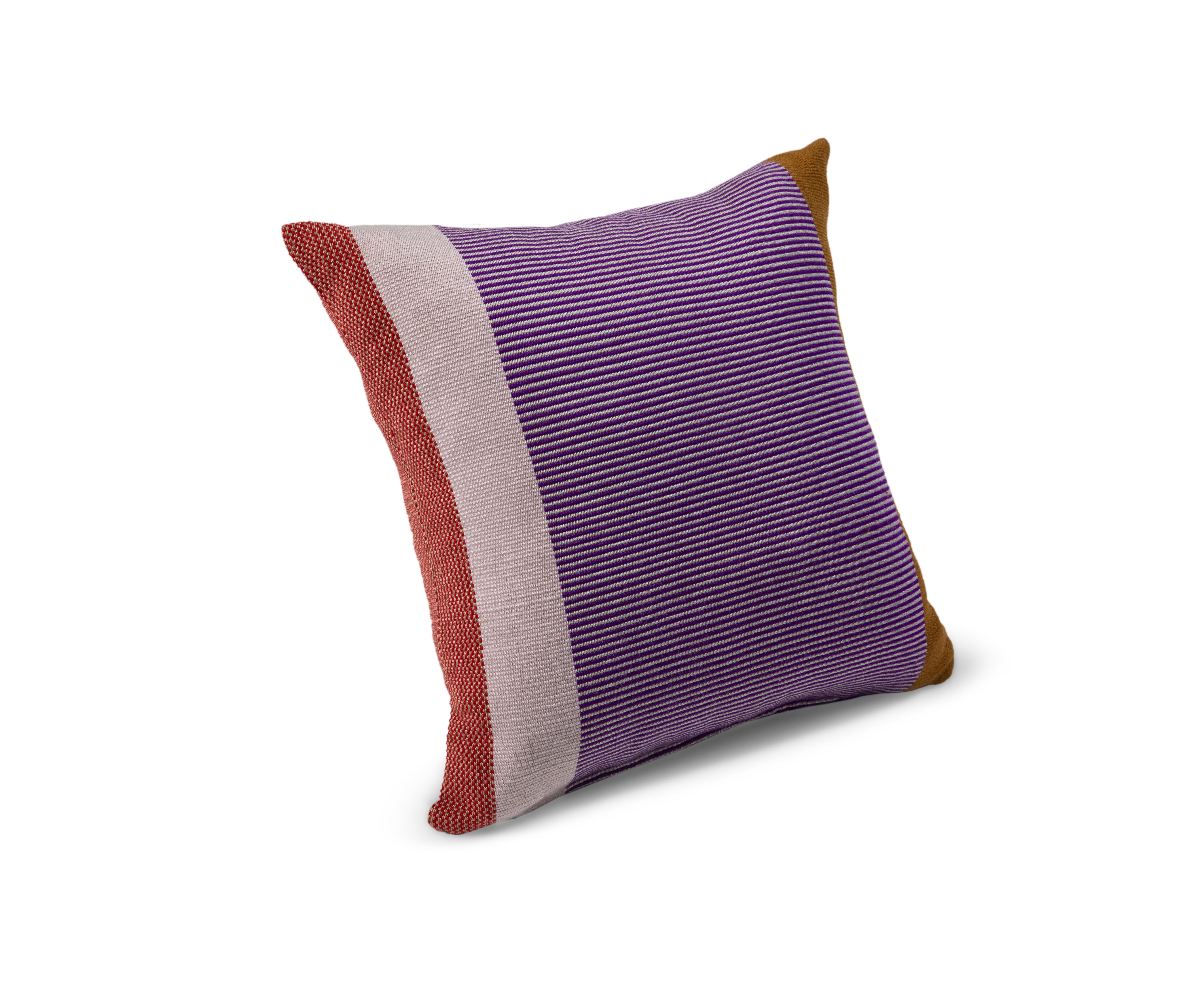Maraca Pillow 3 by Sebastian Herkner
Materials: 100% Cotton. 
Technique: Hand-woven in Colombia. 
Dimensions: W 80 x H 80 cm 
Available in colors: verde/ purpura/ rojo, naranja/ dorado/ rojo, dorado/ purpura/ rojo.

With their strong
