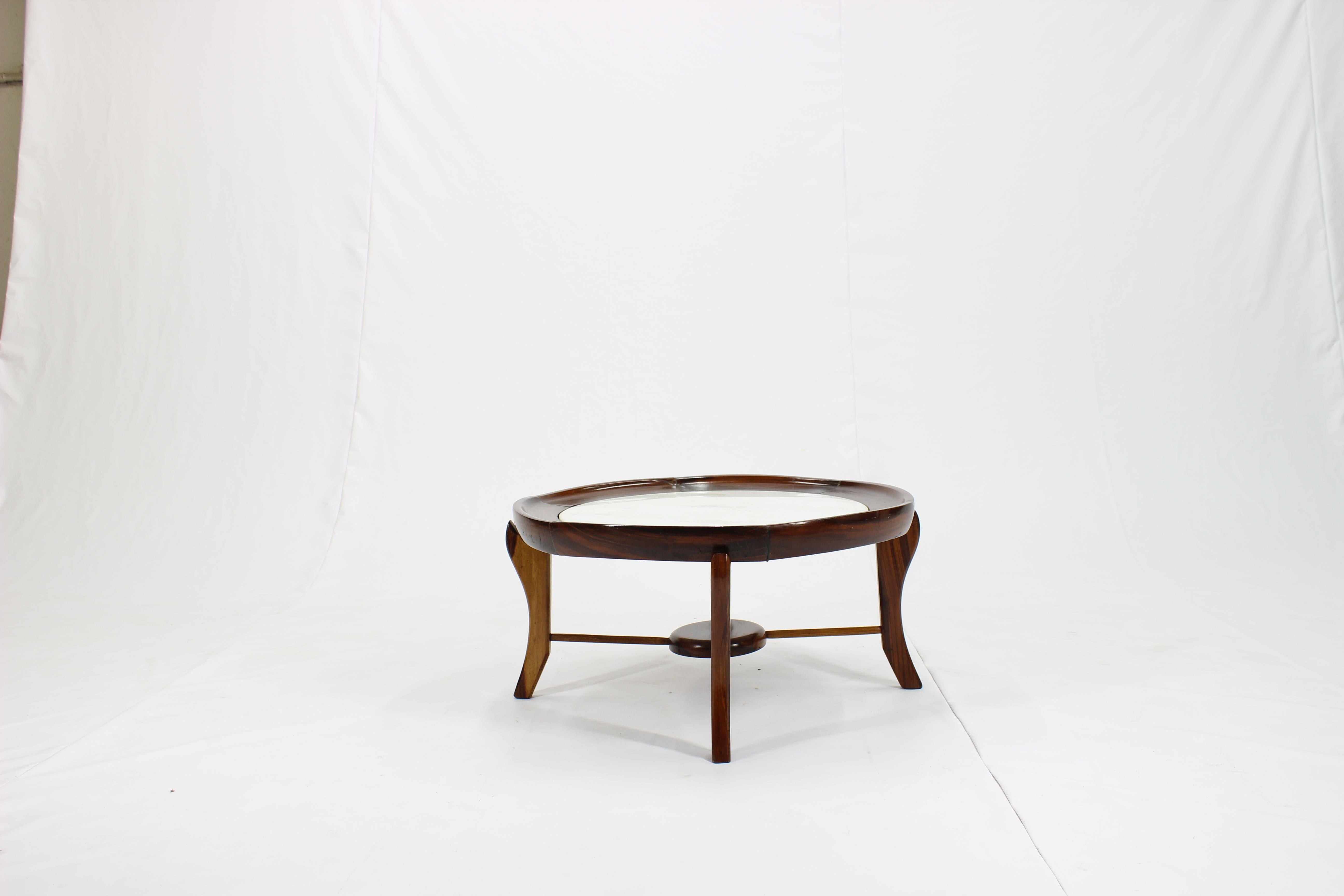 This circa 1960s 'Maracana' table attributed to designer Giuseppe Scapinelli, comes in rich Brazilian jacaranda wood, with marble top against a round concave frame, above uniquely formed cabriole legs, with spreaders joined by a central lower tier.