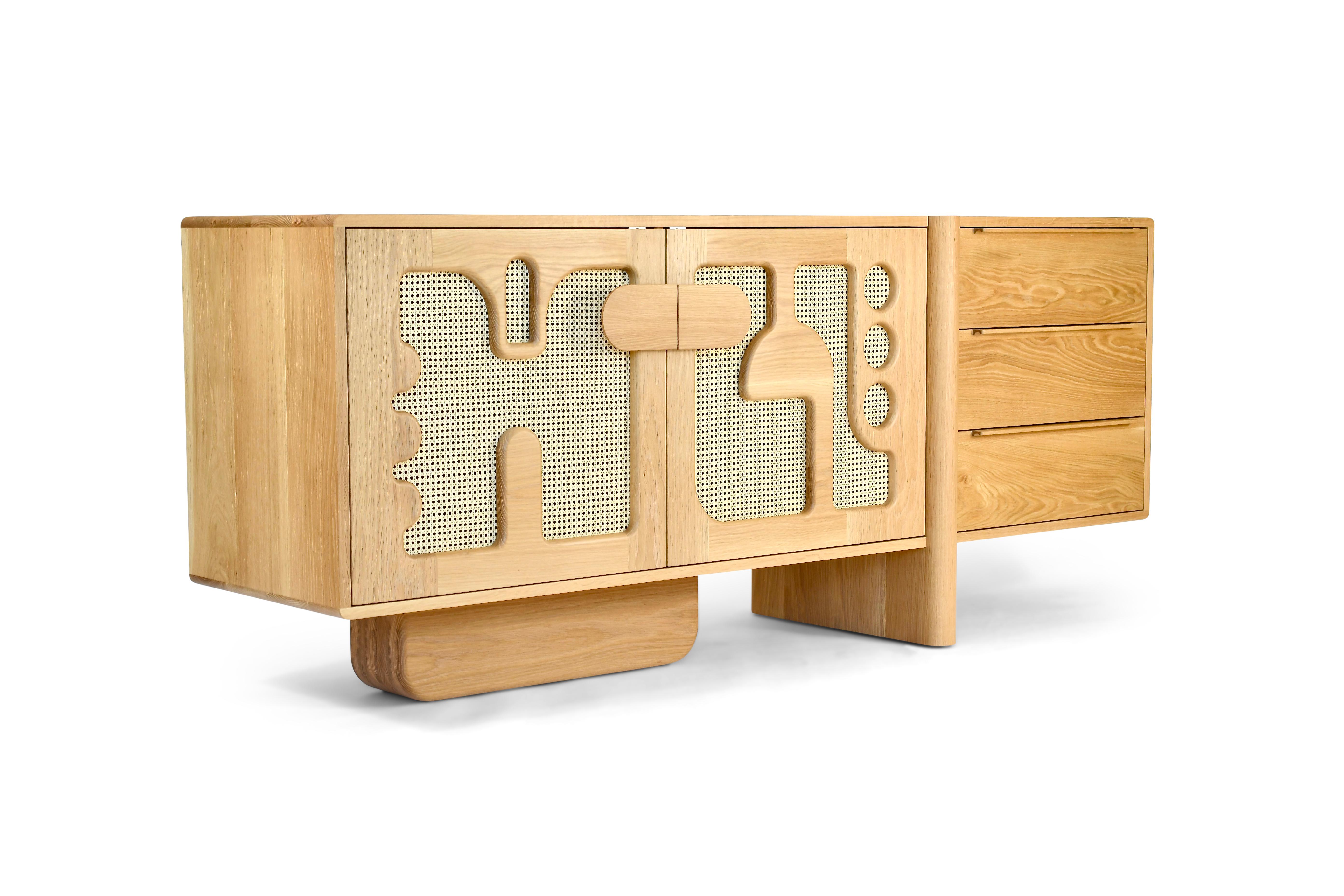 The Marais Credenza finds its inspiration from the bold 1970’s French graphic design style. These contemporary patterns paired with natural caning provide an elevated sculpted statement that embraces the past.

The overall form of this credenza