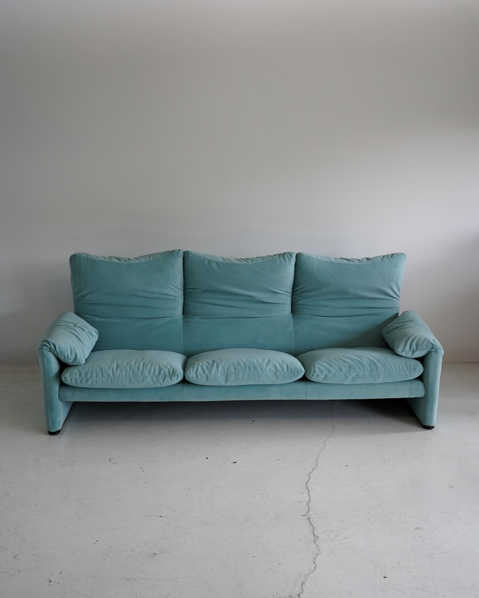 Maralunga 3 seat sofa by Vico Magistretti for Cassina in a soft, light blue velvet. Adjustable headrests allow for multiple positions. 

An iconic design born out of frustration. Unsatisfied with the original design which locked the backrests in
