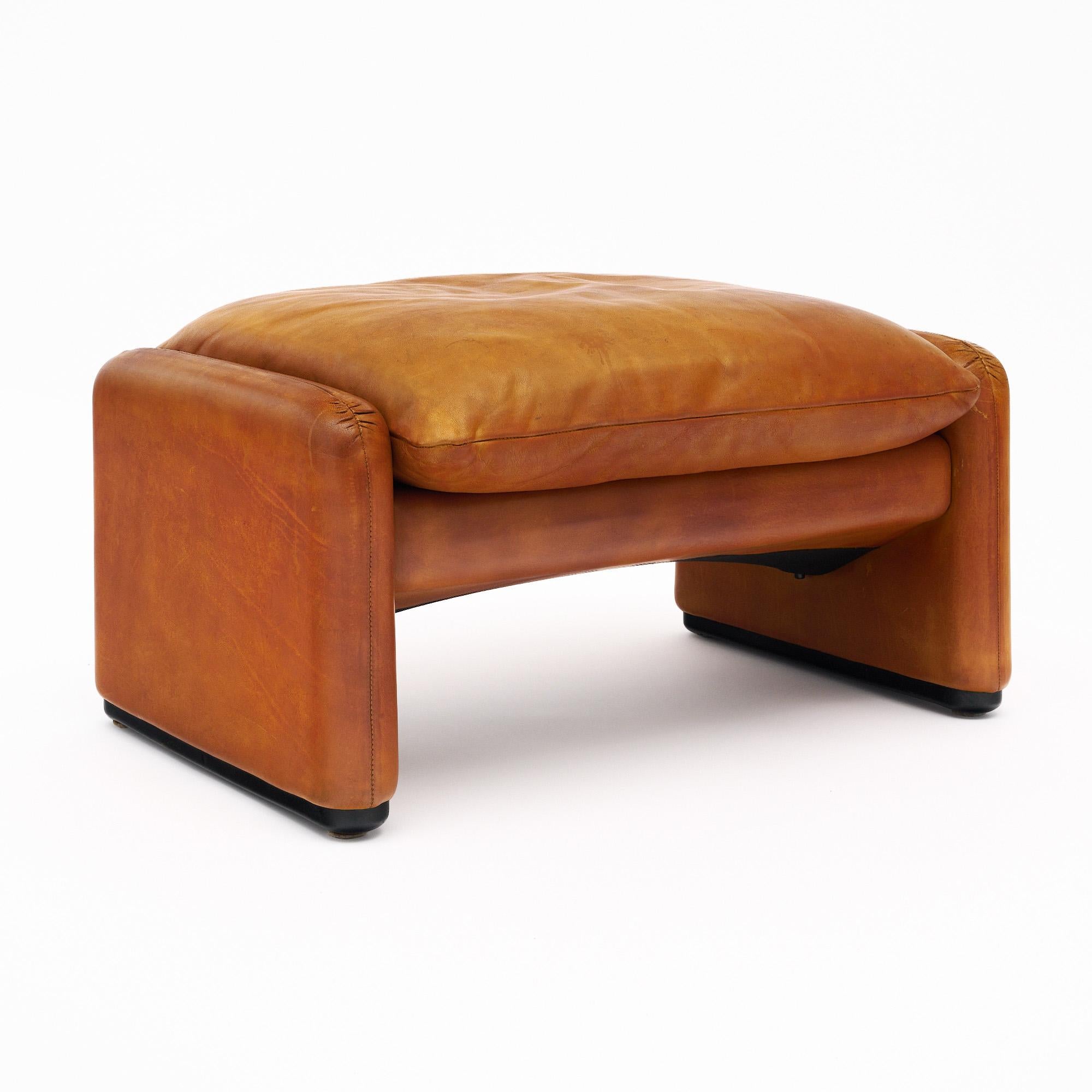 Ottoman from Italy uphostered with the original Italian tan leather. This piece was designed as part of the Maralunga line by Vico Magistretti and crafted by Cassina. Originally designed in 1973, it won Italy’s Compasso D’Oro award for Industrial