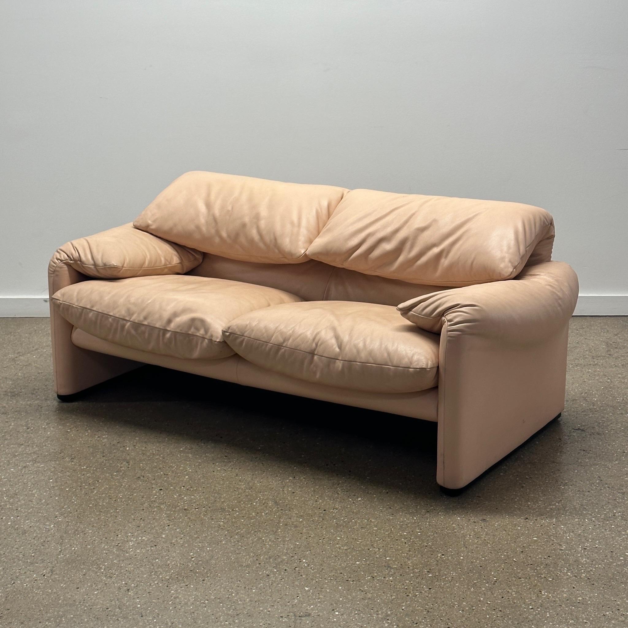 c. 1990s. Full peachy beige leather upholstery. Articulation backrests.