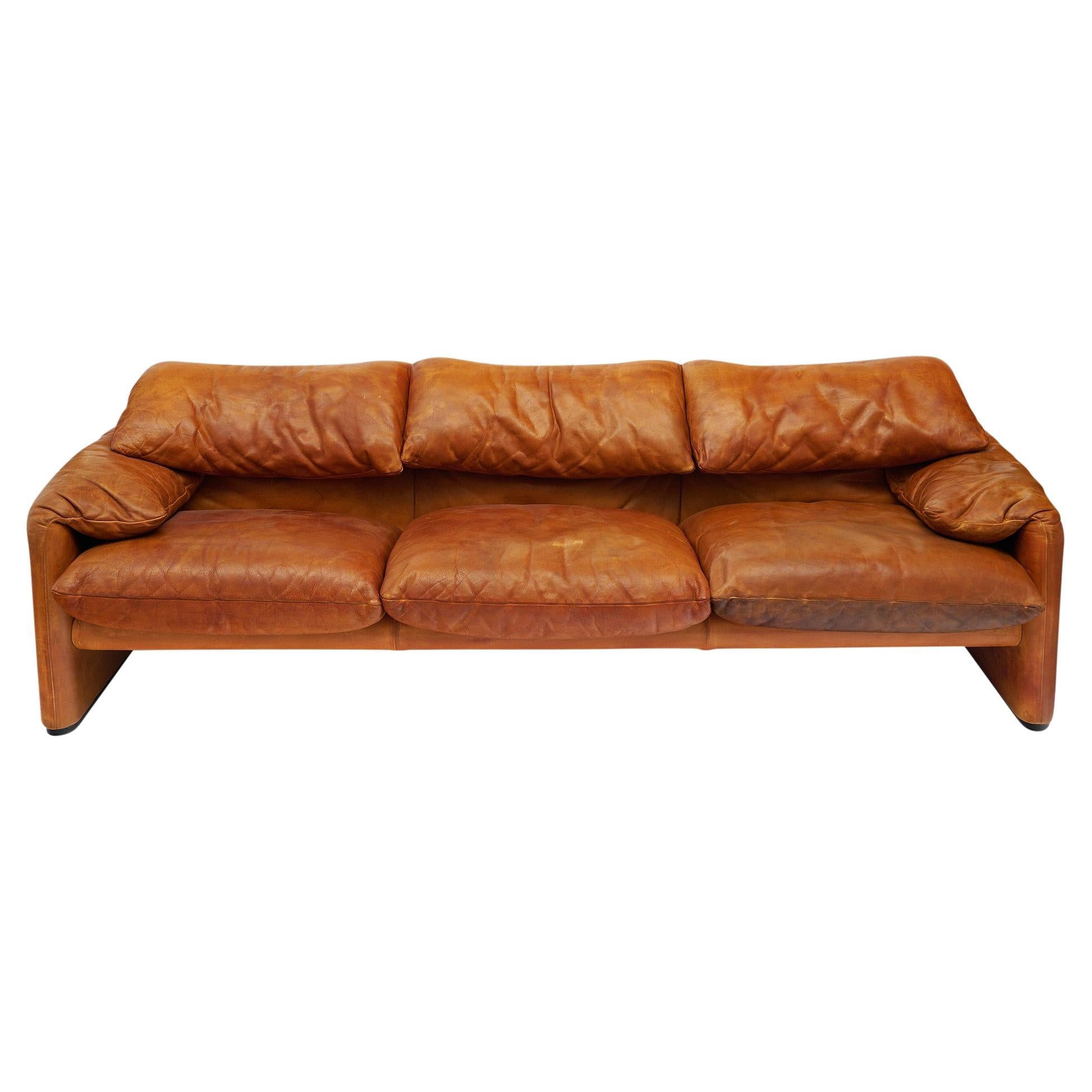 Sofa from Italy made with the original Italian tan leather. This piece was designed as part of the Maralunga line by Vico Magistretti and crafted by Cassina. Originally designed in 1973, it won Italy’s Compasso D’Oro award for Industrial Design in