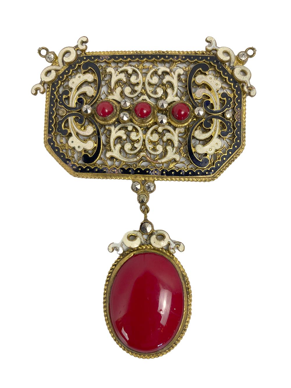 This unusual pendant has it all. very delicate work, stones and gold

