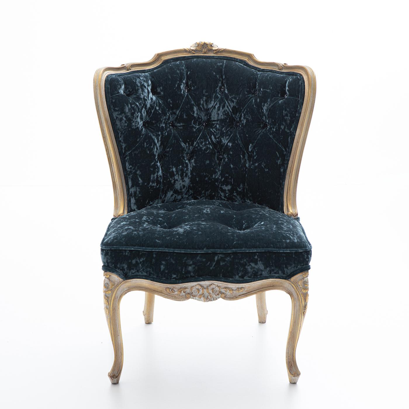 Exuding pure lavish allure, this exclusive chair matching the Louis XV style is a statement-making piece suiting classic interiors. The cabriole-style legs flaunt a gold-leaf coating enriched by a brown and white patina that extends to the profile