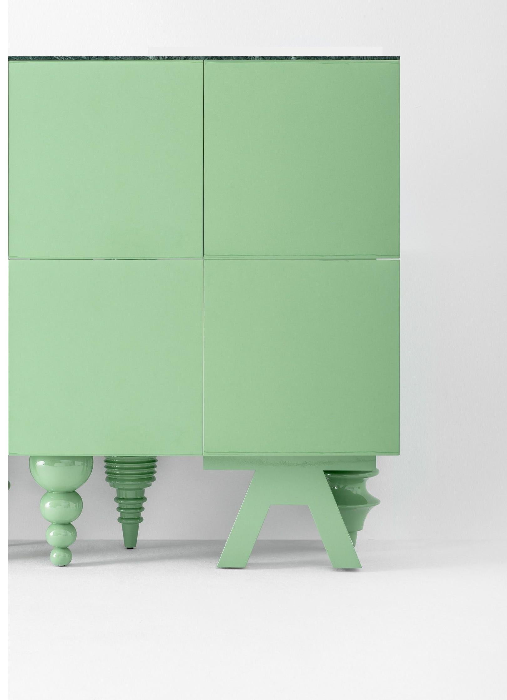Marble 1 + 1 meter multileg cabinet by Jaime Hayon
Dimensions: D 50 x W 100 x H 130 cm 
Materials: containers, doors, and shelves in MDF with different widths. Legs in turned solid alder wood. Monochrome lacquered finishes are available in green