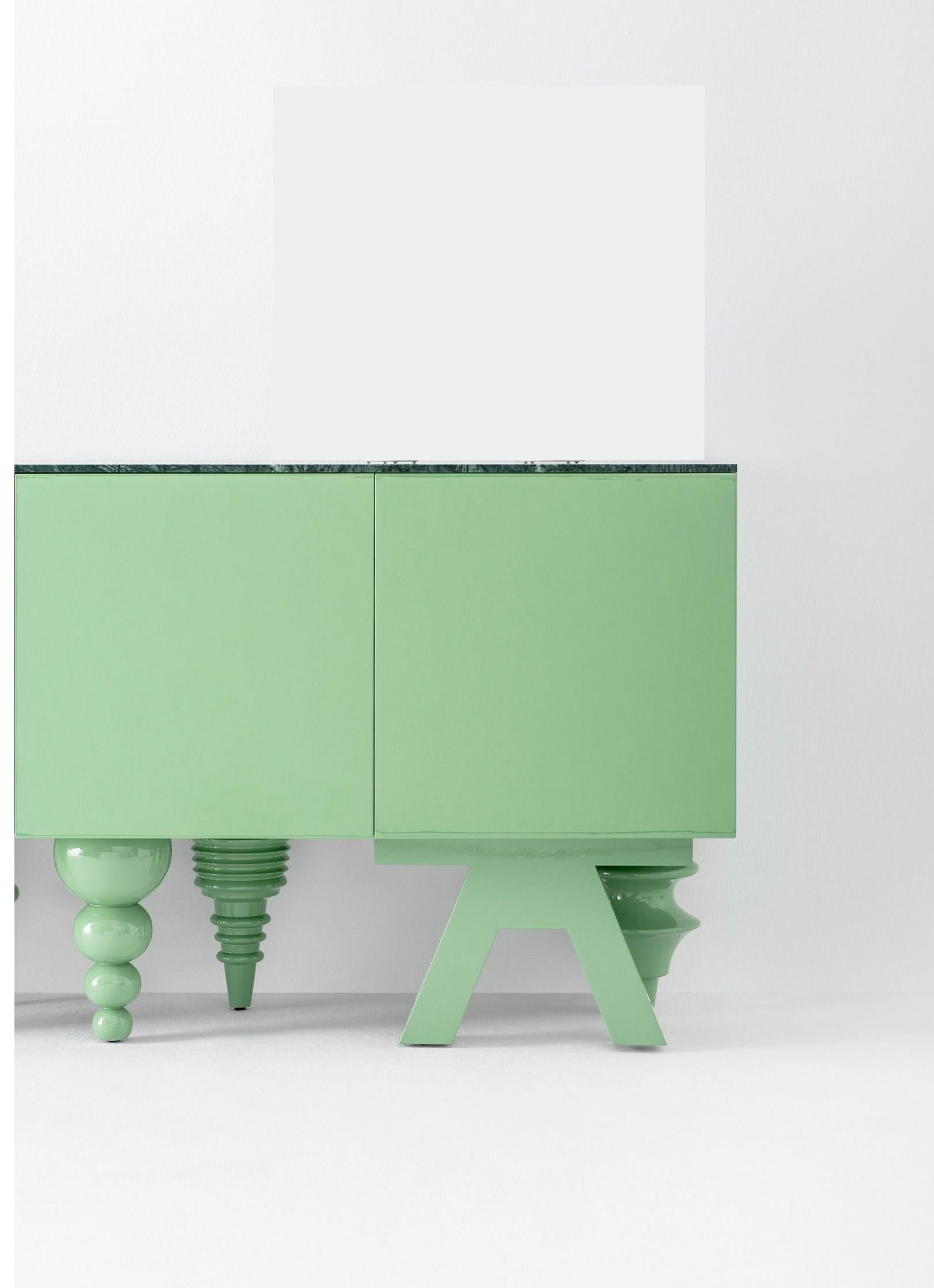 Marble 1 meter multileg cabinet by Jaime Hayon
Dimensions: D 50 x W 100 x H 80 cm 
Materials: Containers, doors, and shelves in MDF with different widths. Legs in turned solid alder wood. Monochrome lacquered finishes are available in green RAL