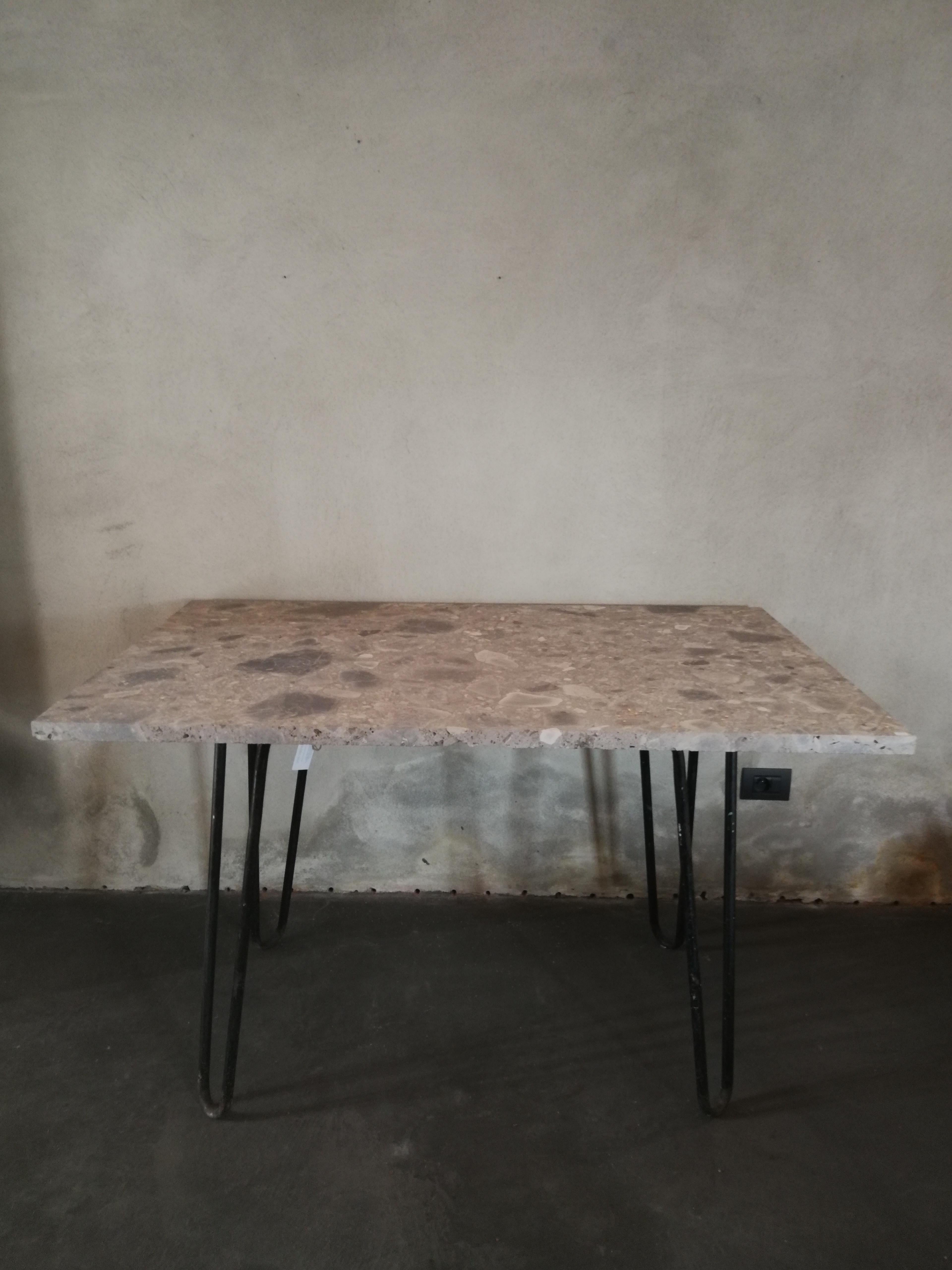 This table is a recent composition out of midcentury metal feet and a new grey marble top. The feet are so called hairpin legs and have been recycled. It is perfect to use for a console table, although it is not suitable for a desk.