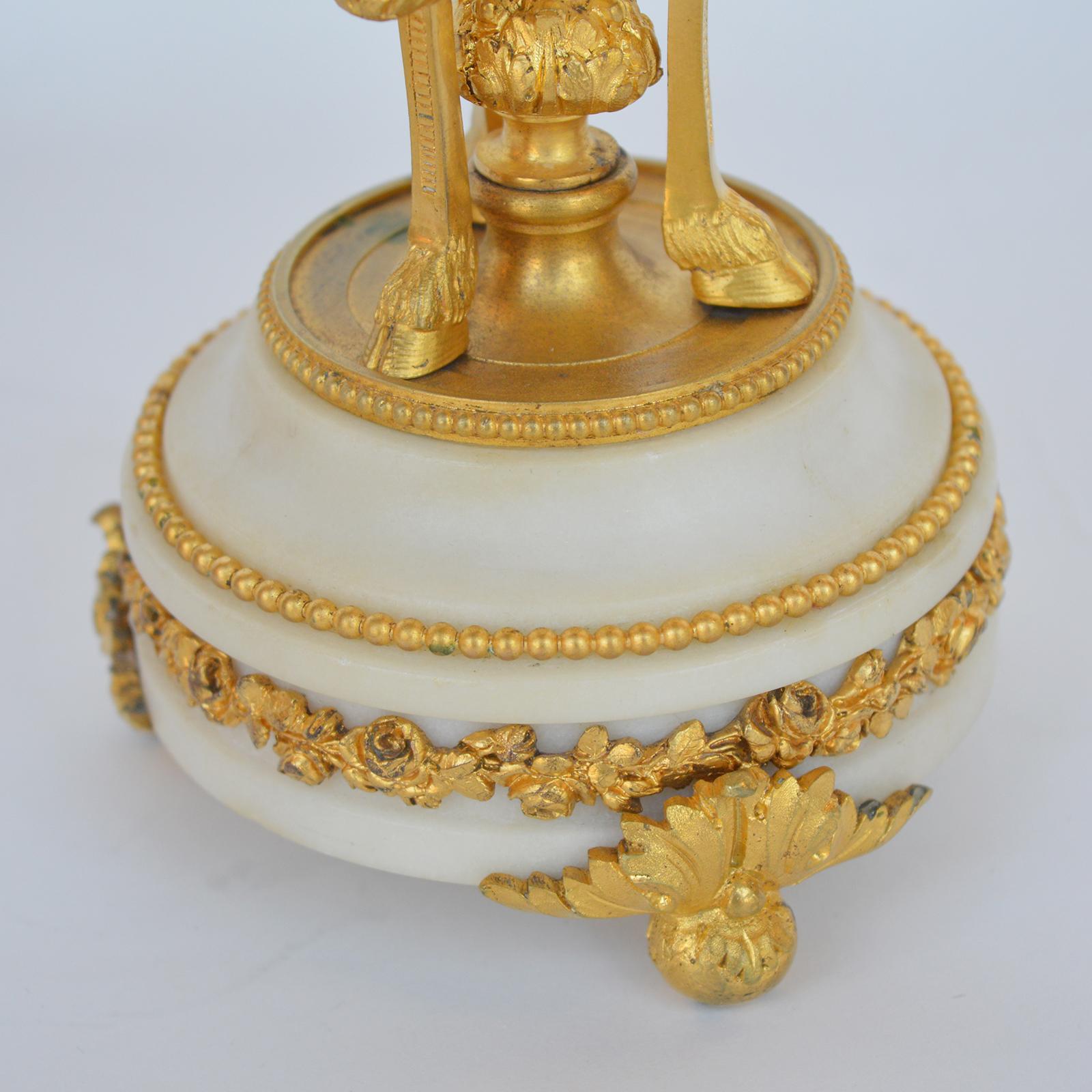 Marble and bronze clock Garniture after Jean-Michel Clodion French 1738-1814.