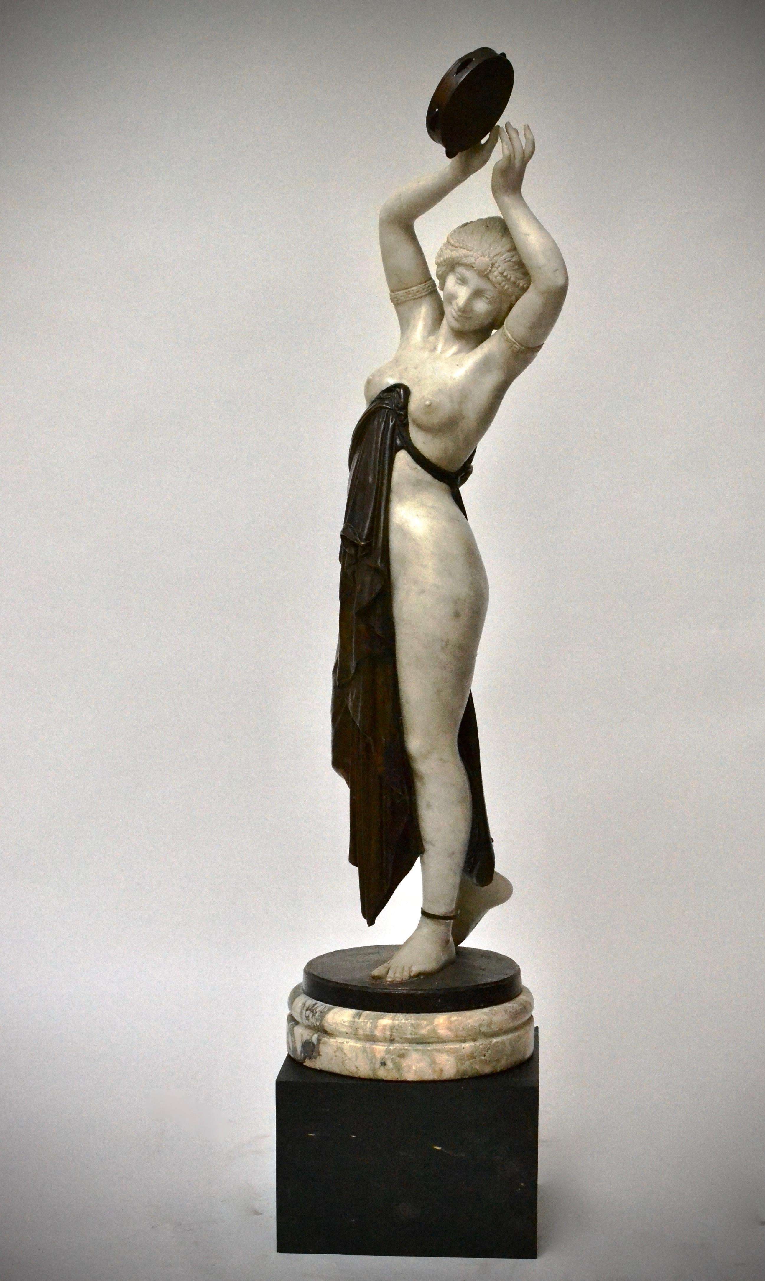 A large marble and bronze sculpture of dancing woman with a tambourine. Italian and made in the  second half of the 19th century.