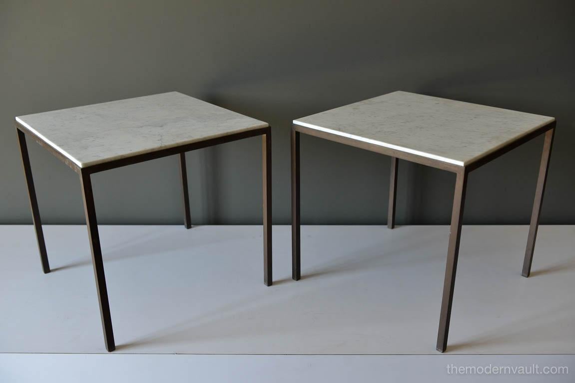 Carrara marble and bronze framed side tables in the manner of Harvey Probber or Paul McCobb. Beautiful patina on the bronze frames, solid legs with white Carrara marble tops in excellent condition.

Measure 18