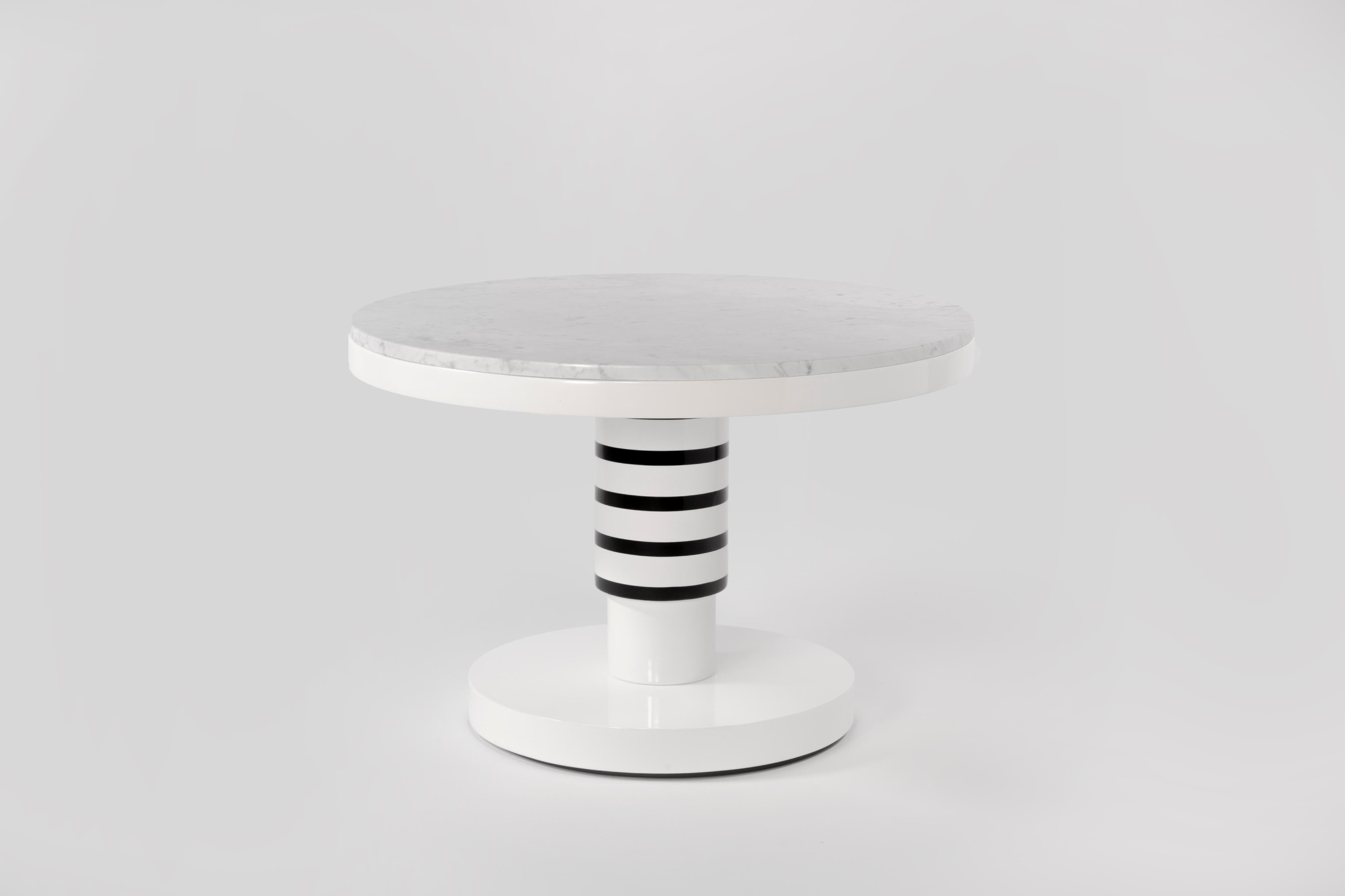 Marble and ceramic coffee table by Eric Willemart
Materials: Top: Polished Carrara marble paate embedded in a white lacquered 
 Wooden Tray
 Body: Handcrafted ceramic glazed in black, white and silver finishes
 Base: White lacquered wood on an