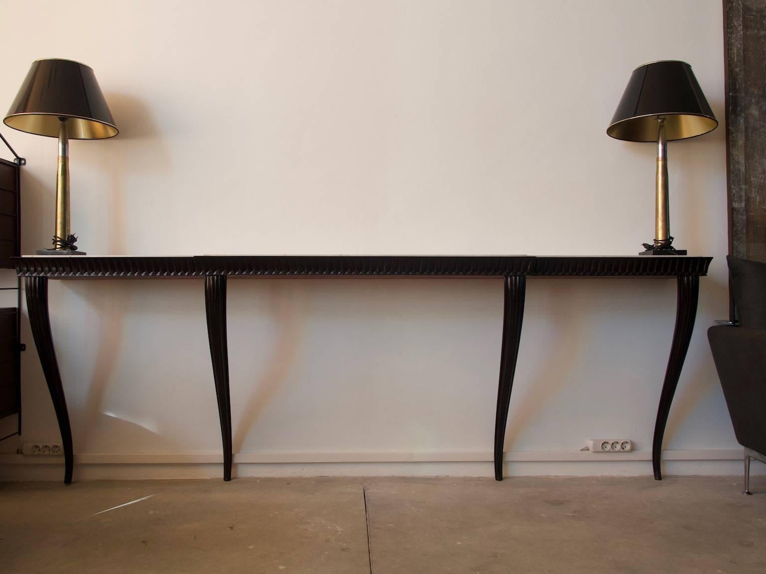 Beautiful streamlined console table with ebonized wooden structure and marble top designed by Paolo Buffa. Produced in Italy, circa 1950.