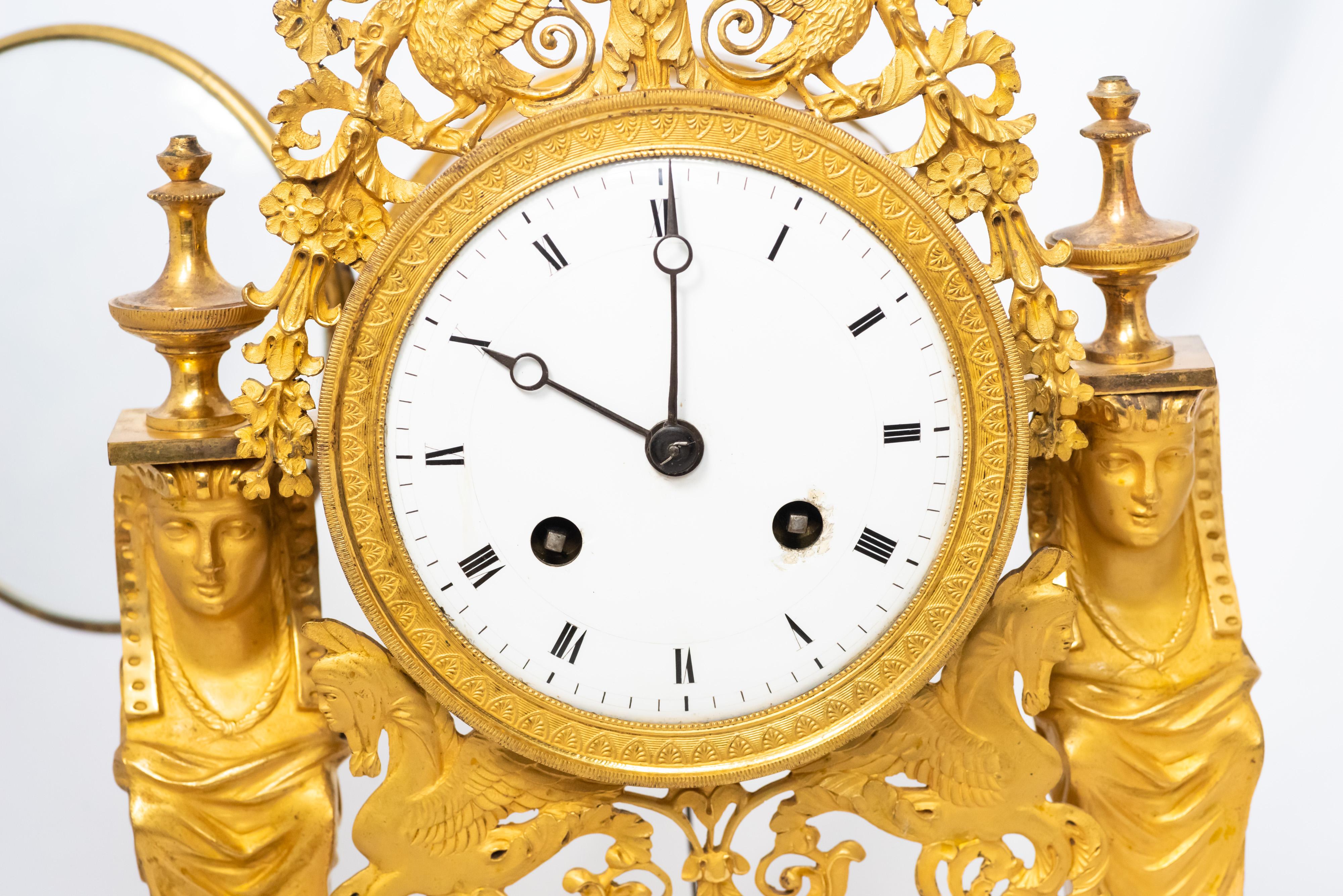 A small, svelte French portico clock from the Directory Era, 1795-99. In the 