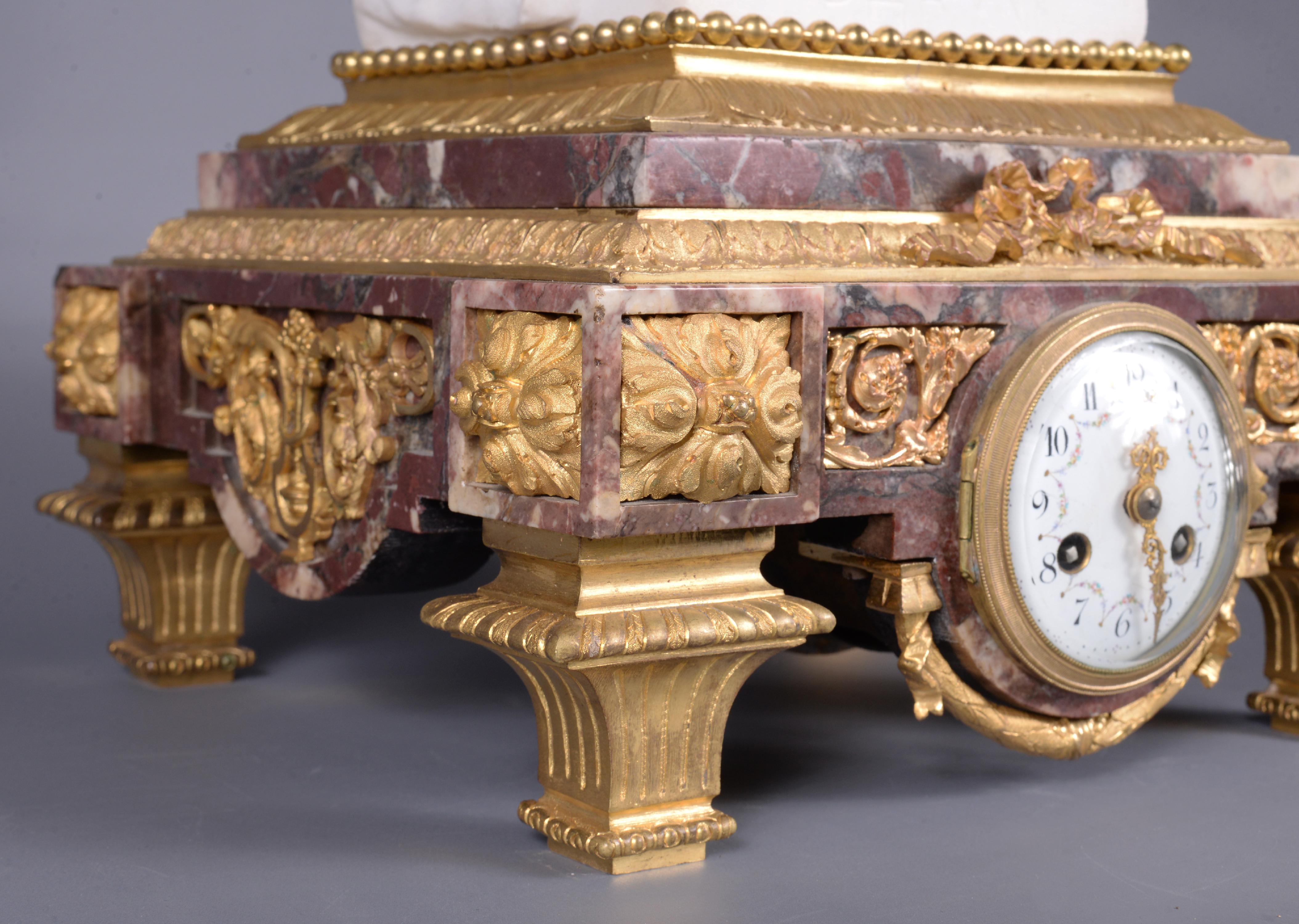 Marble and gilt bronze clock surmounted by a statuary white marble sculpture 4