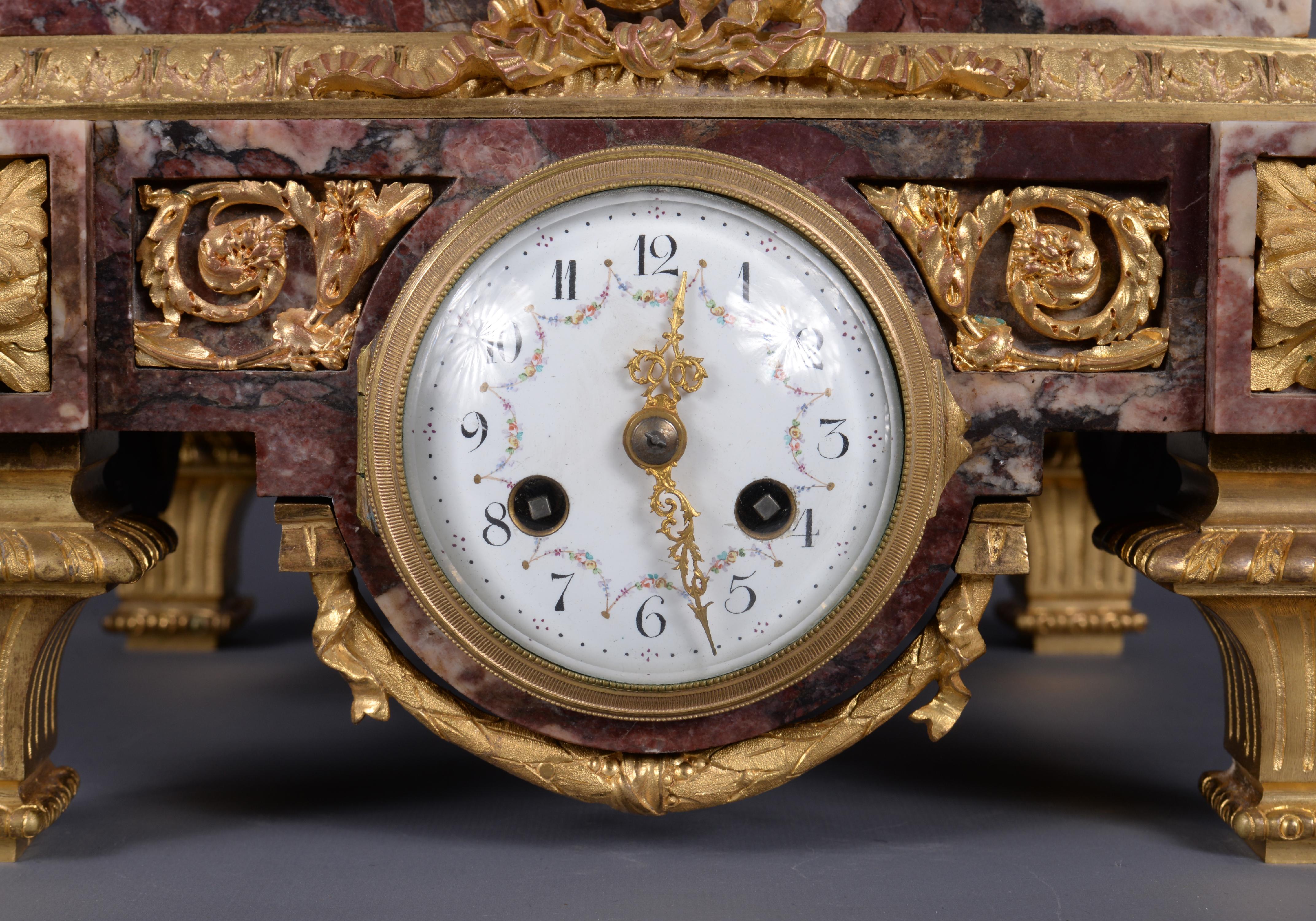Marble and gilt bronze clock surmounted by a statuary white marble sculpture 5