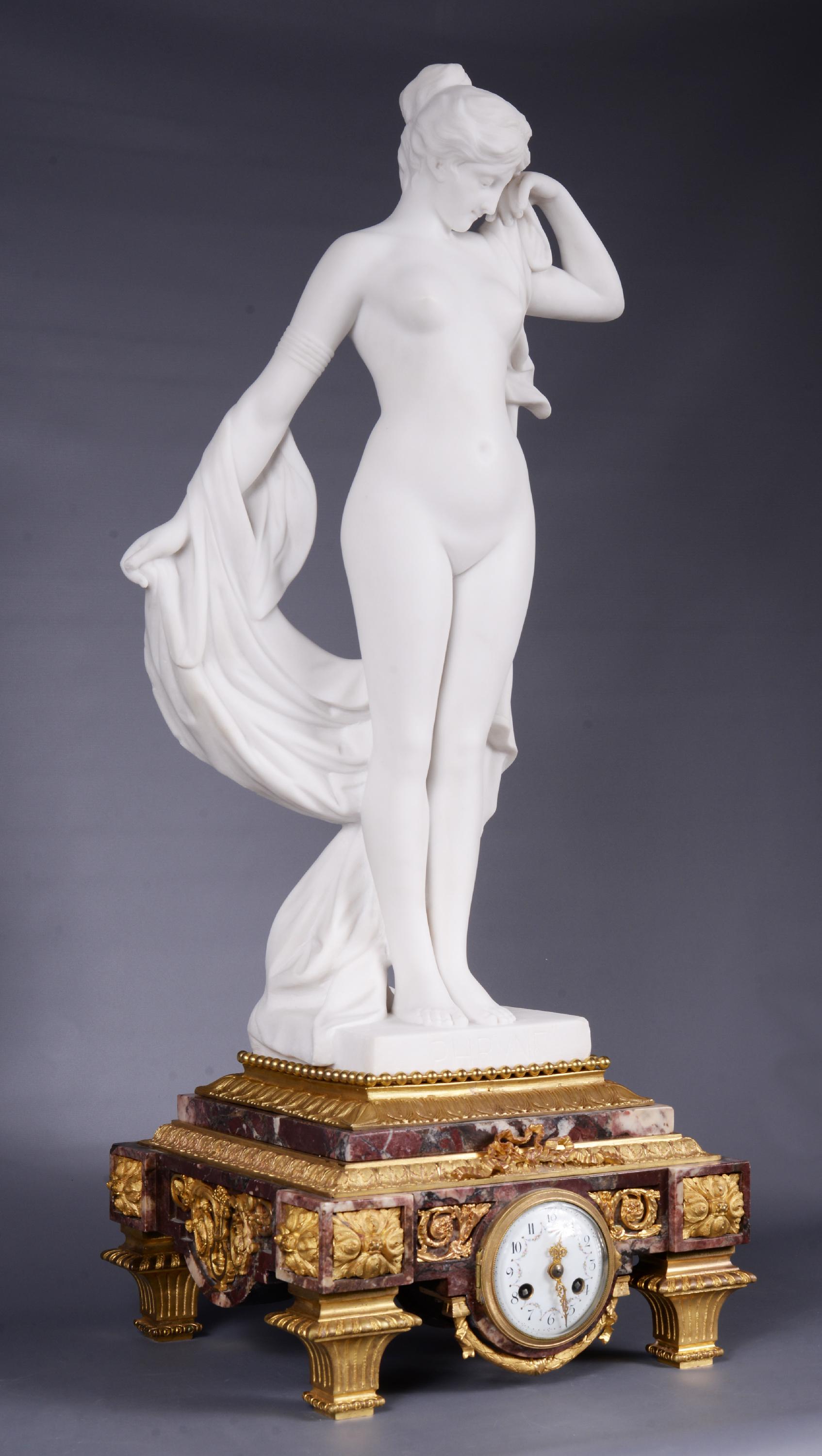 This clock presents a reduced reproduction in statuary white marble of 