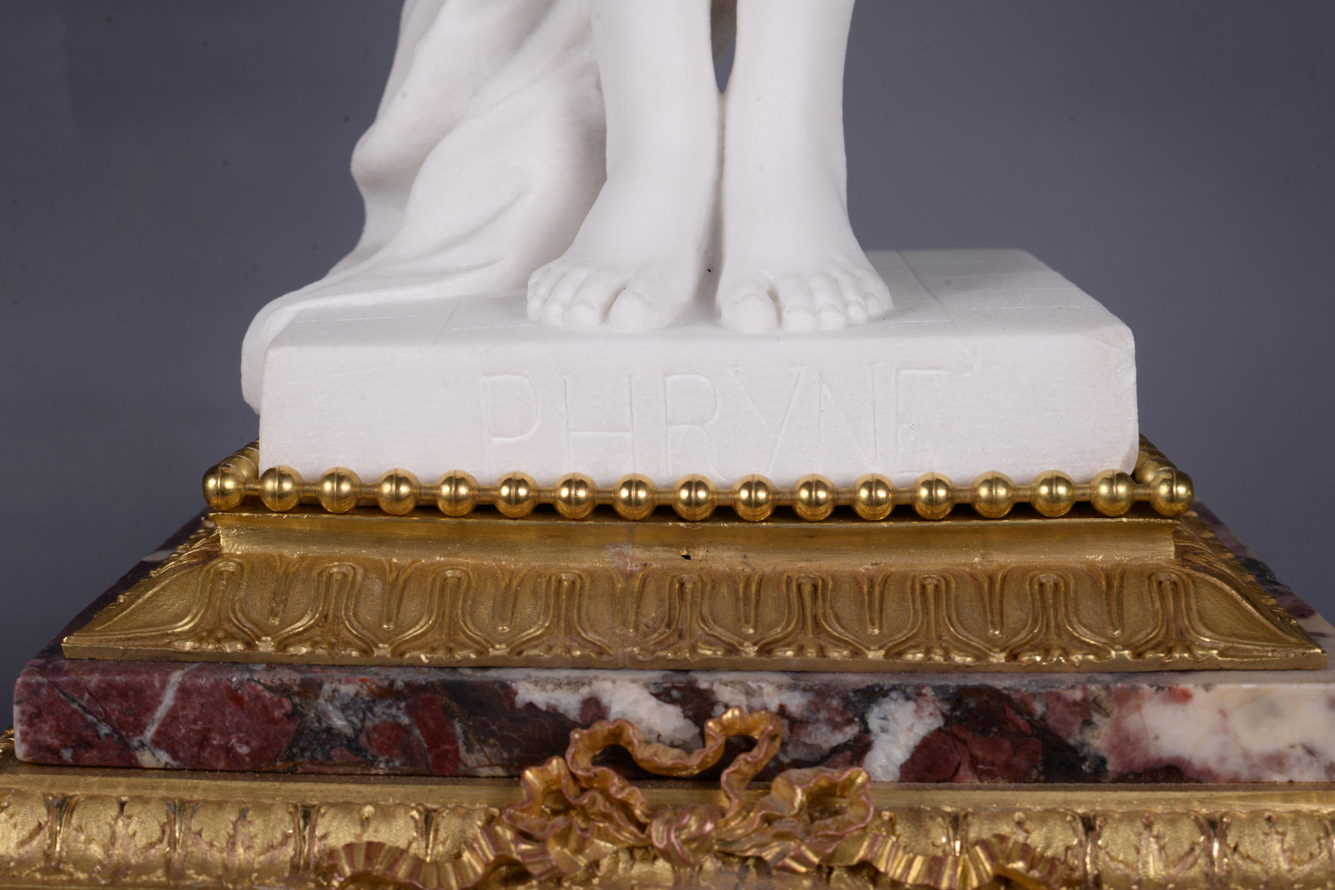 Marble and gilt bronze clock surmounted by a statuary white marble sculpture 2