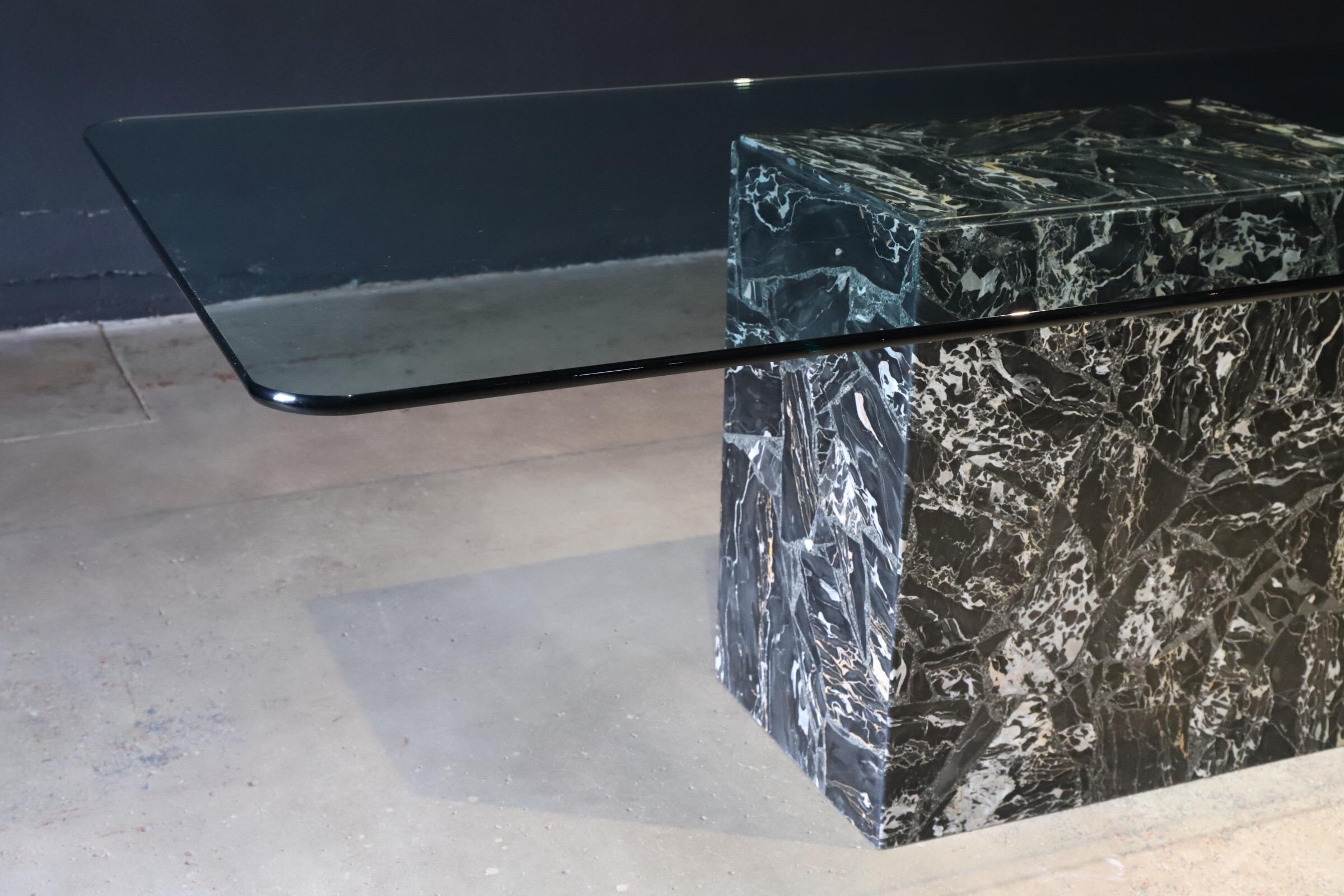 Stunning chunked marble base with floating glass top dining table or conference table. Seating for eight (8). Airy & unique. Photographed with Eames Herman Miller fiberglass arm shell and Charlotte Perriand dining chairs for scale.