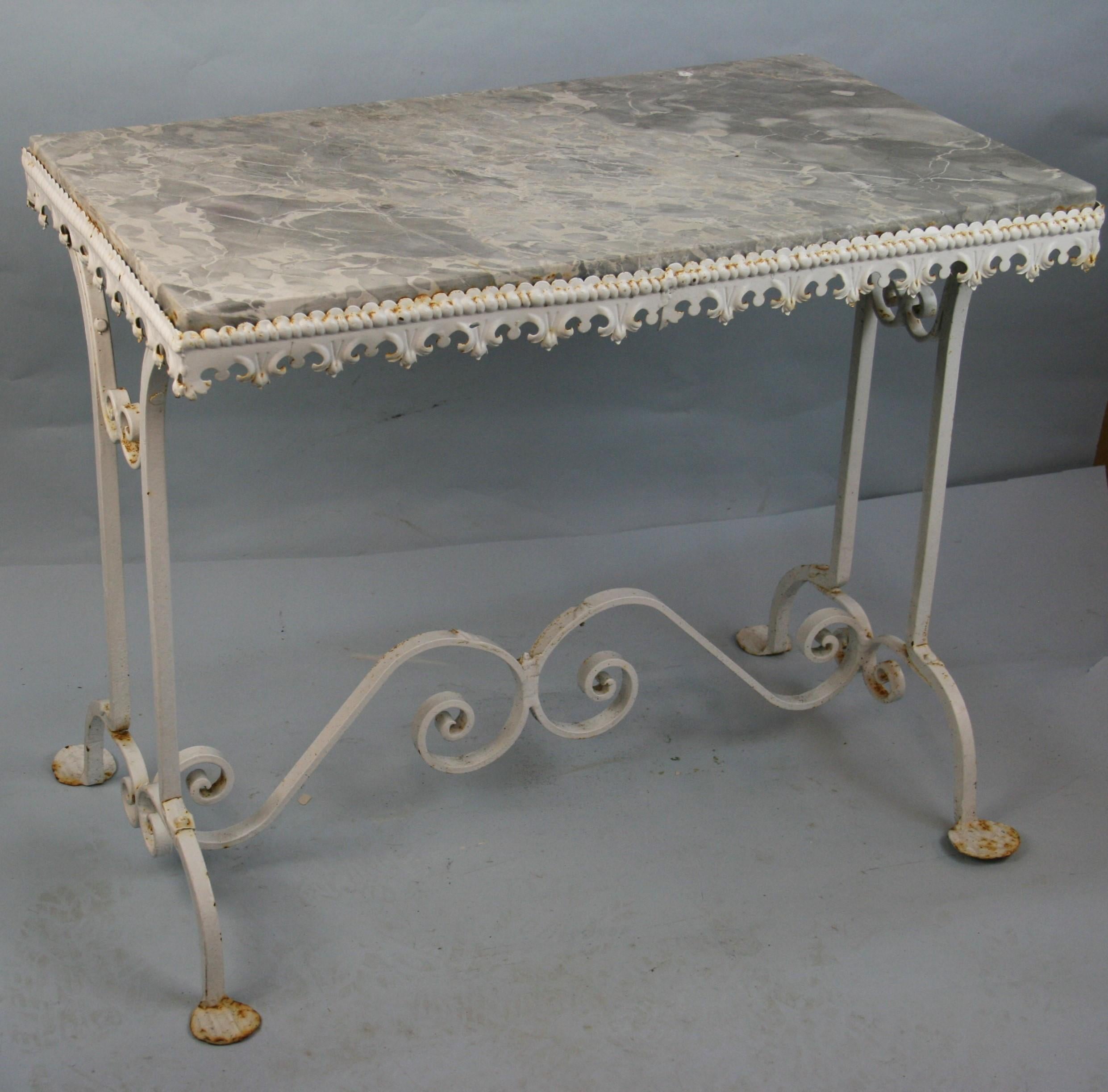 Grey and white marble top garden table.