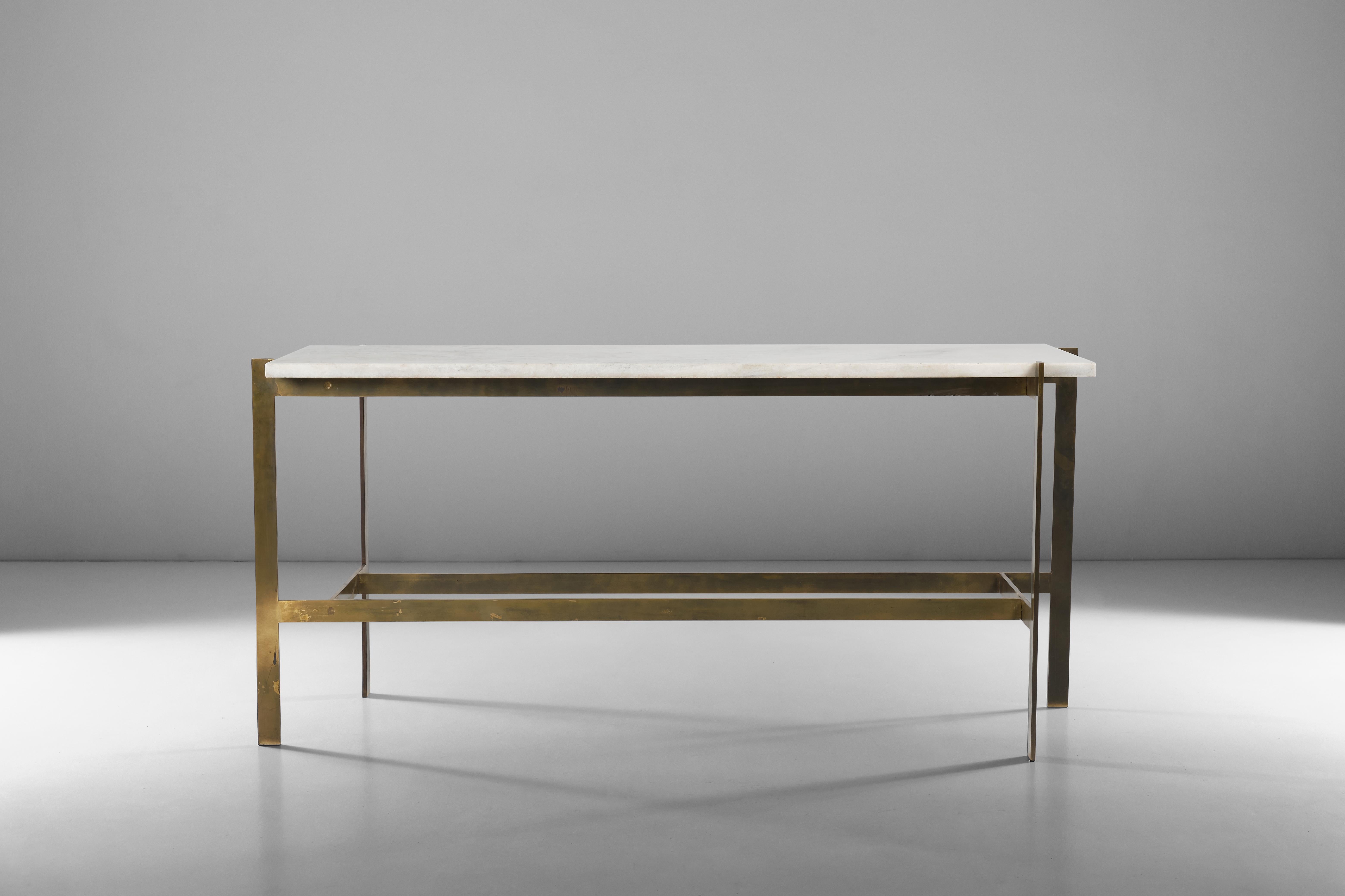 Sleek and stylish, this console features a magnificent white marble top. The brass base attached to it conveys stability and elegance at the same time thanks to attention to details and an unmistaken sense of proportions.
Attributed to Romeo Rega,