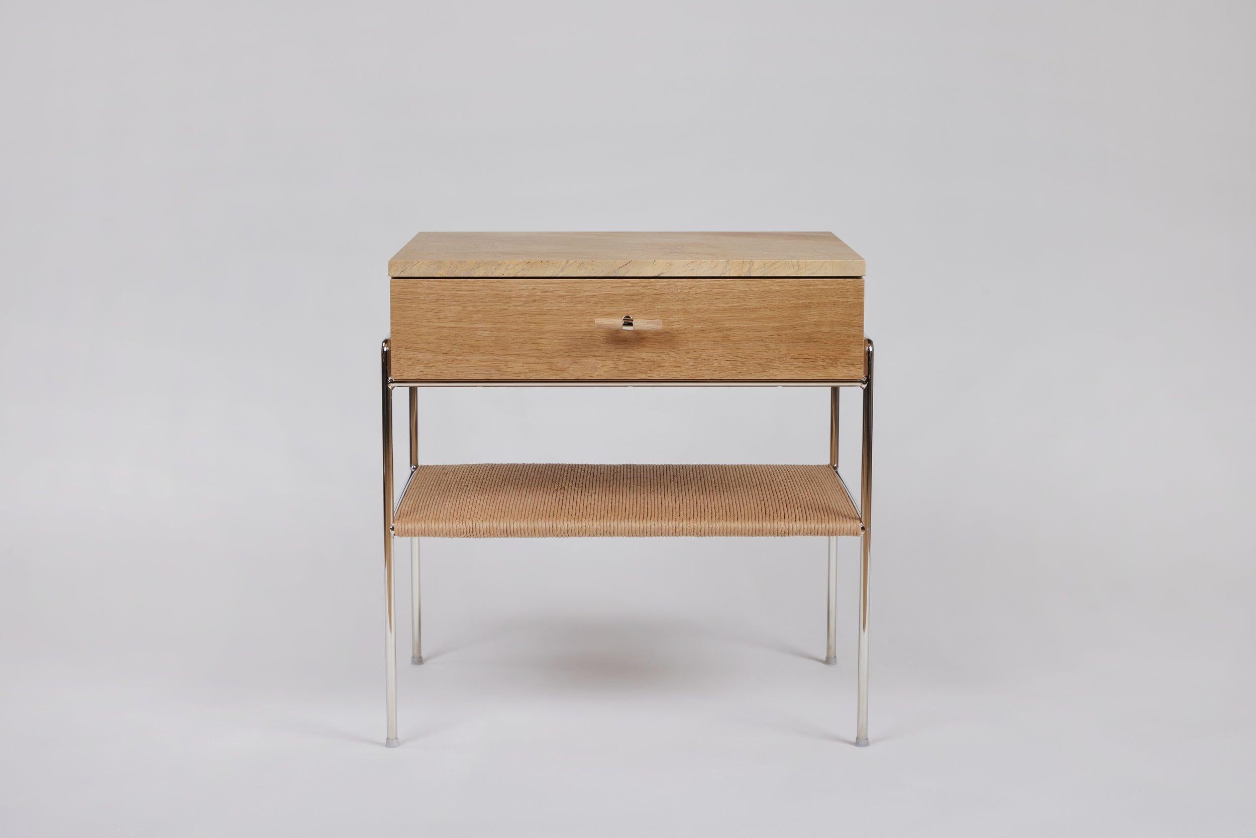 The oak side table is made from a single hand selected solid white oak board, ensuring consistent coloring and matching grain patterns throughout. It is fabricated by an artisan who has been building fine furniture for almost a half century.  

The