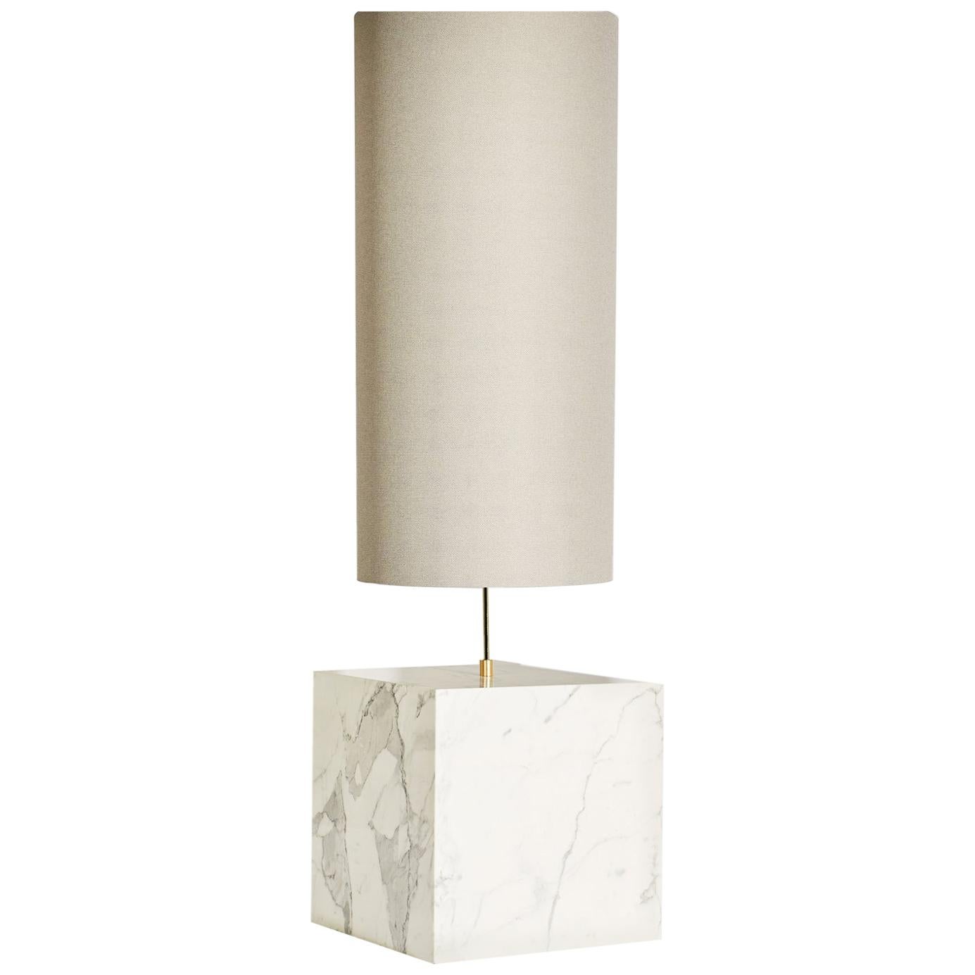The Coexist Floor Lamp consists of a marble cube base and a lampshade made from recycled fabric.

The lamp serves as a sculptural centerpiece for any room, emitting a soft warm light to draw the viewer into the materials. The bold geometry of the