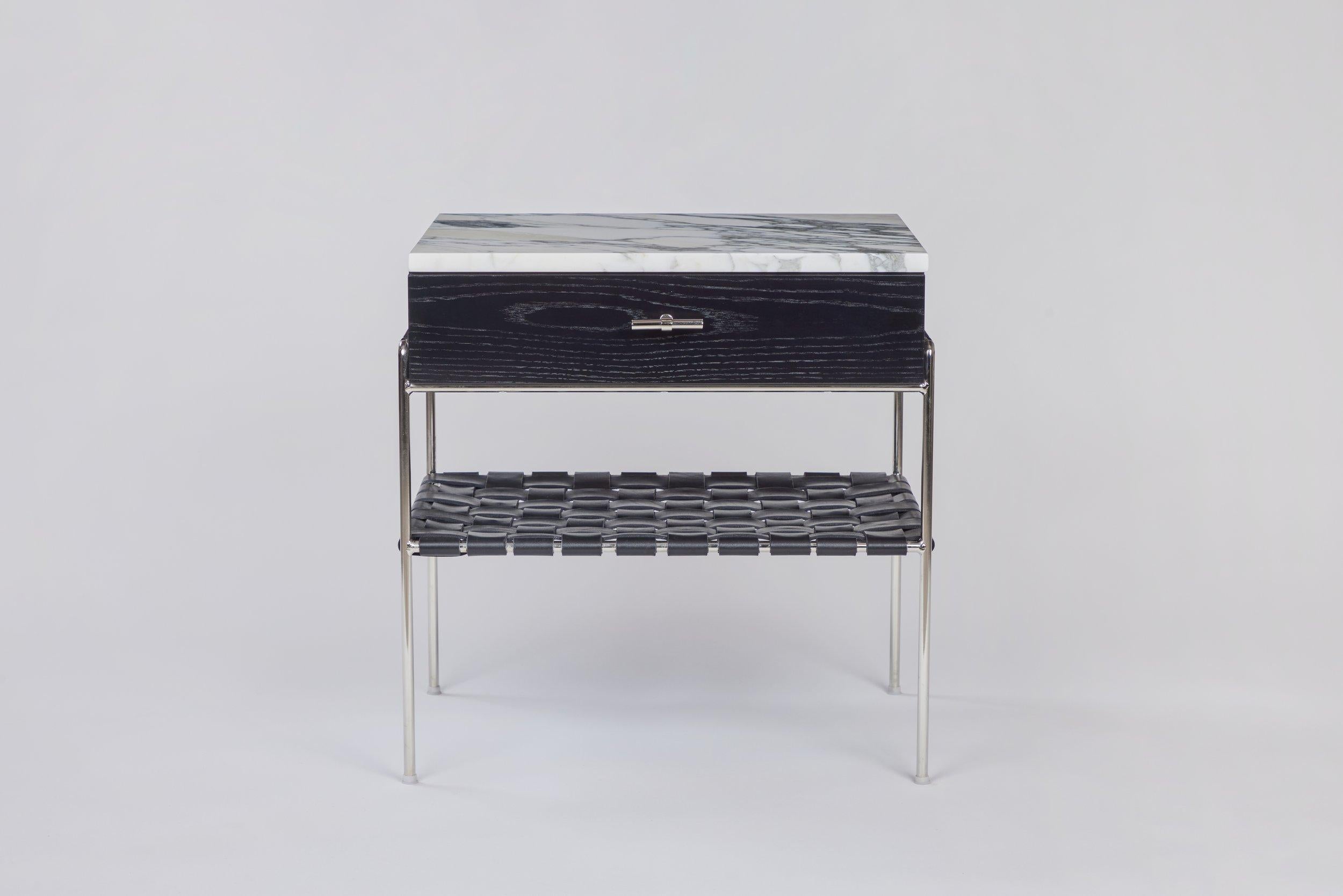 The stained oak side table is made from a single hand selected solid white oak board, ensuring consistent coloring and matching grain patterns throughout. It is fabricated by an artisan who has been building fine furniture for almost a half century.