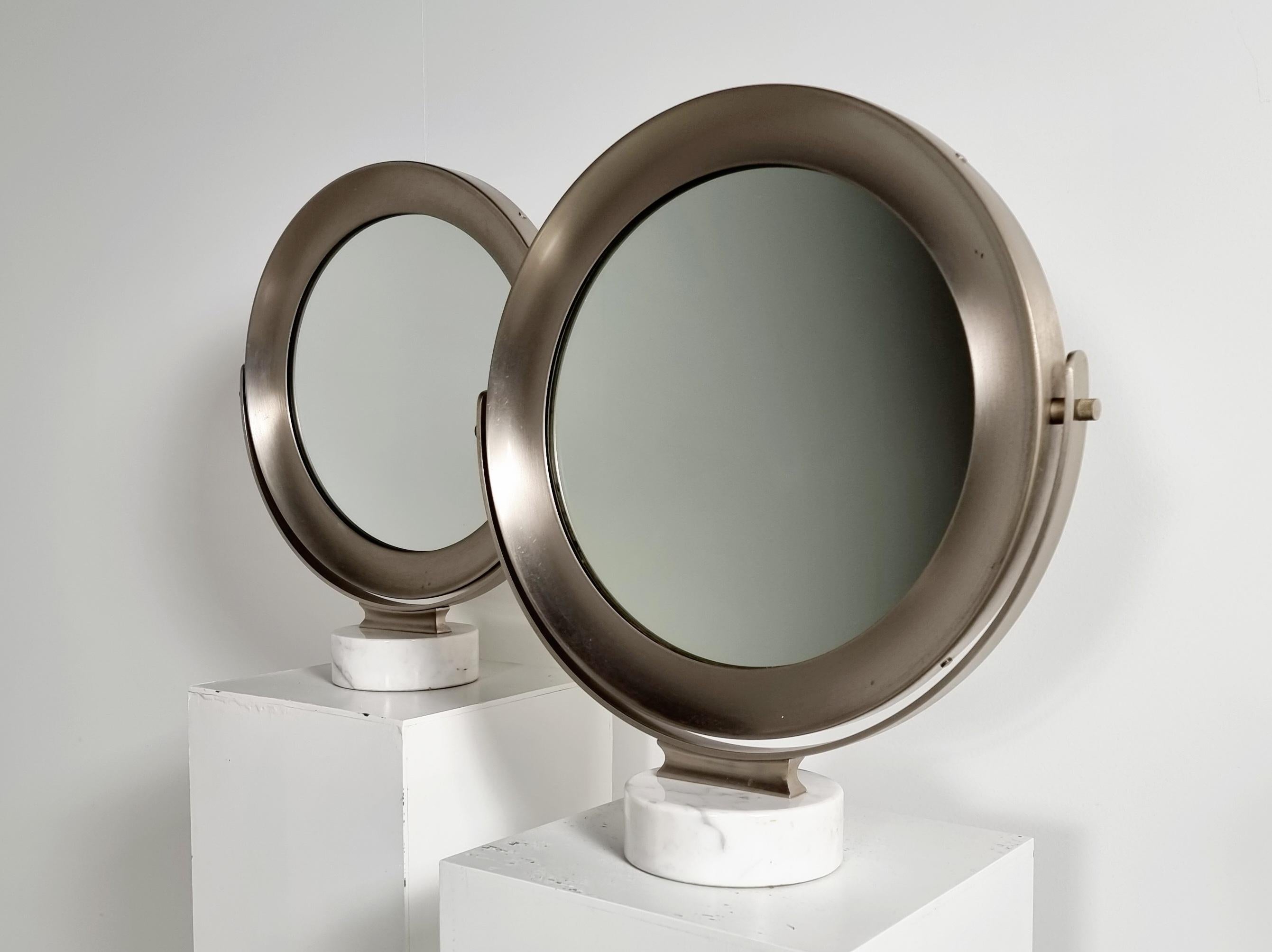 Carrara marble and steel Narciso table mirror by Sergio Mazza for Artemide, the 1970s. With a cylindrical base in white Carrara marble and support structure for the tilting mirror in satin steel, as well as the frame itself.