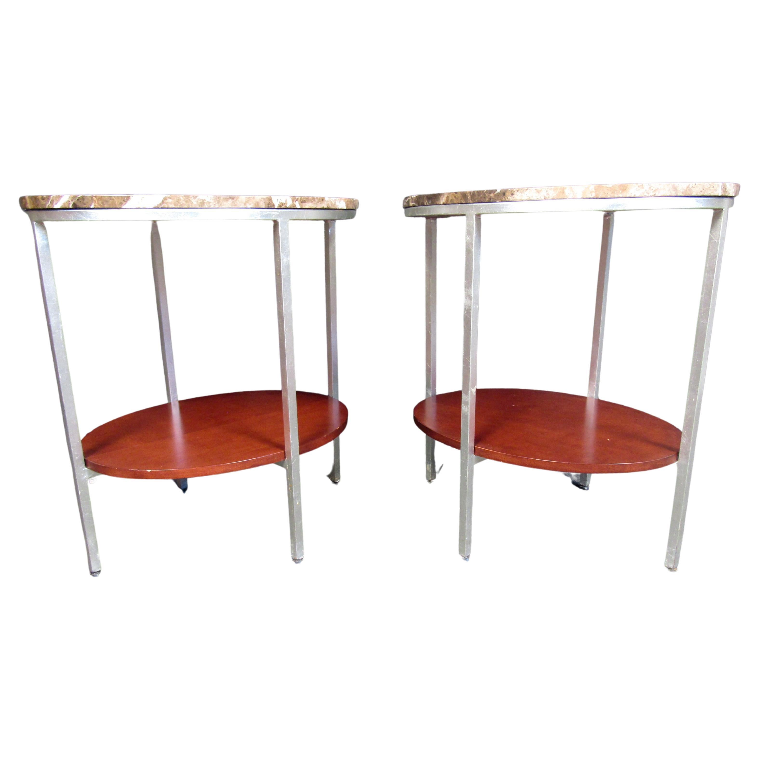 These two tier mid century style end tables feature a beautiful marble top, wood second tier and stunning metal construct. This pair of tables will be sure to add pop to your living or office space. Please confirm item location (NJ or NY).