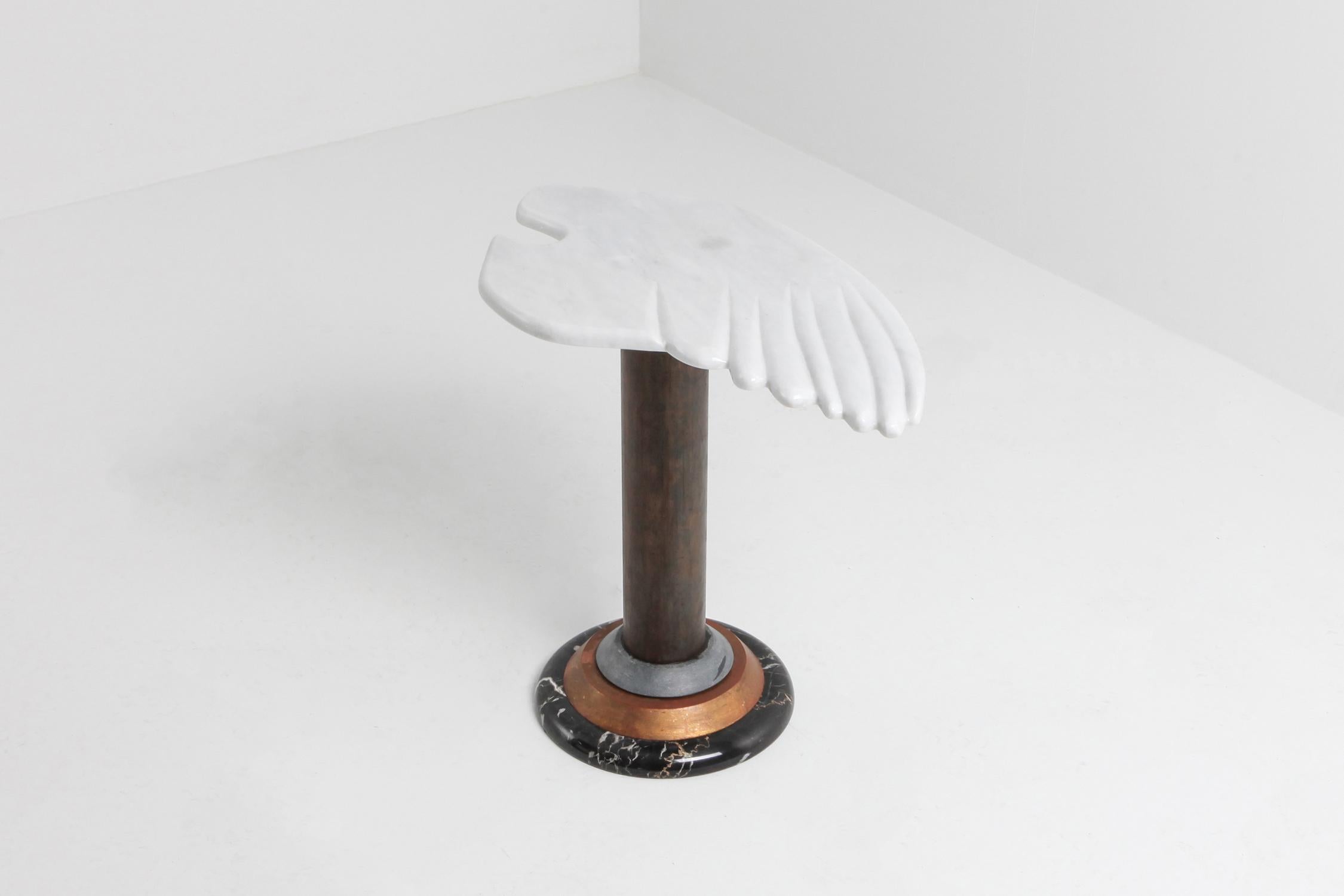 Postmodern angelical occasional table in marble, stone and copper
great eclectic chic piece in marble in a much more sculptural and figurative design than the pieces by Mangiarotti and Bellini.


