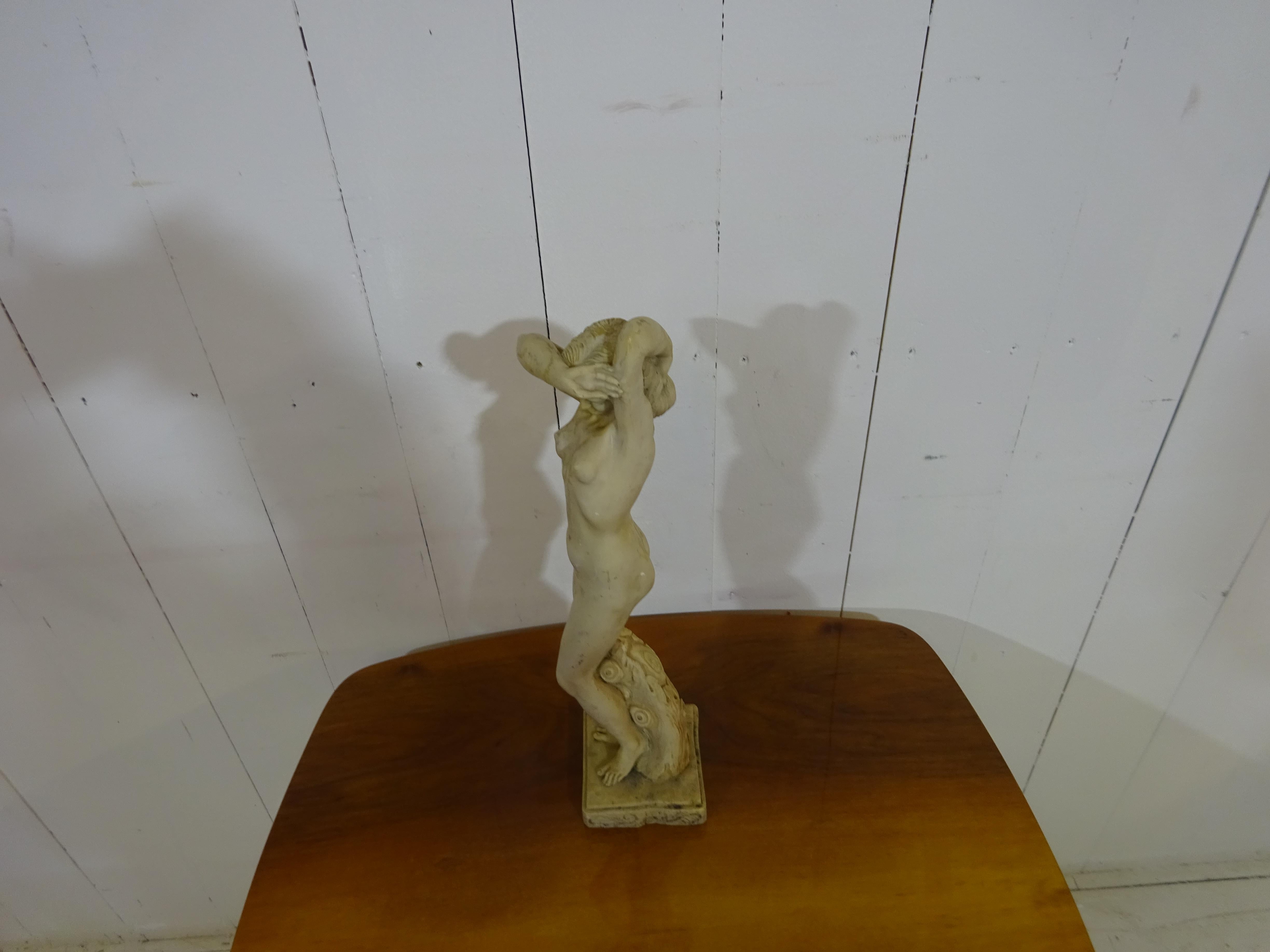 Art Deco statue.

A stunning original art deco statue dated circa early 1920's. 

Statue depicts a naked lady in a garden. From the same family home since new the statue has a lovely patina and is hand carved in a off white marble. Carved on a