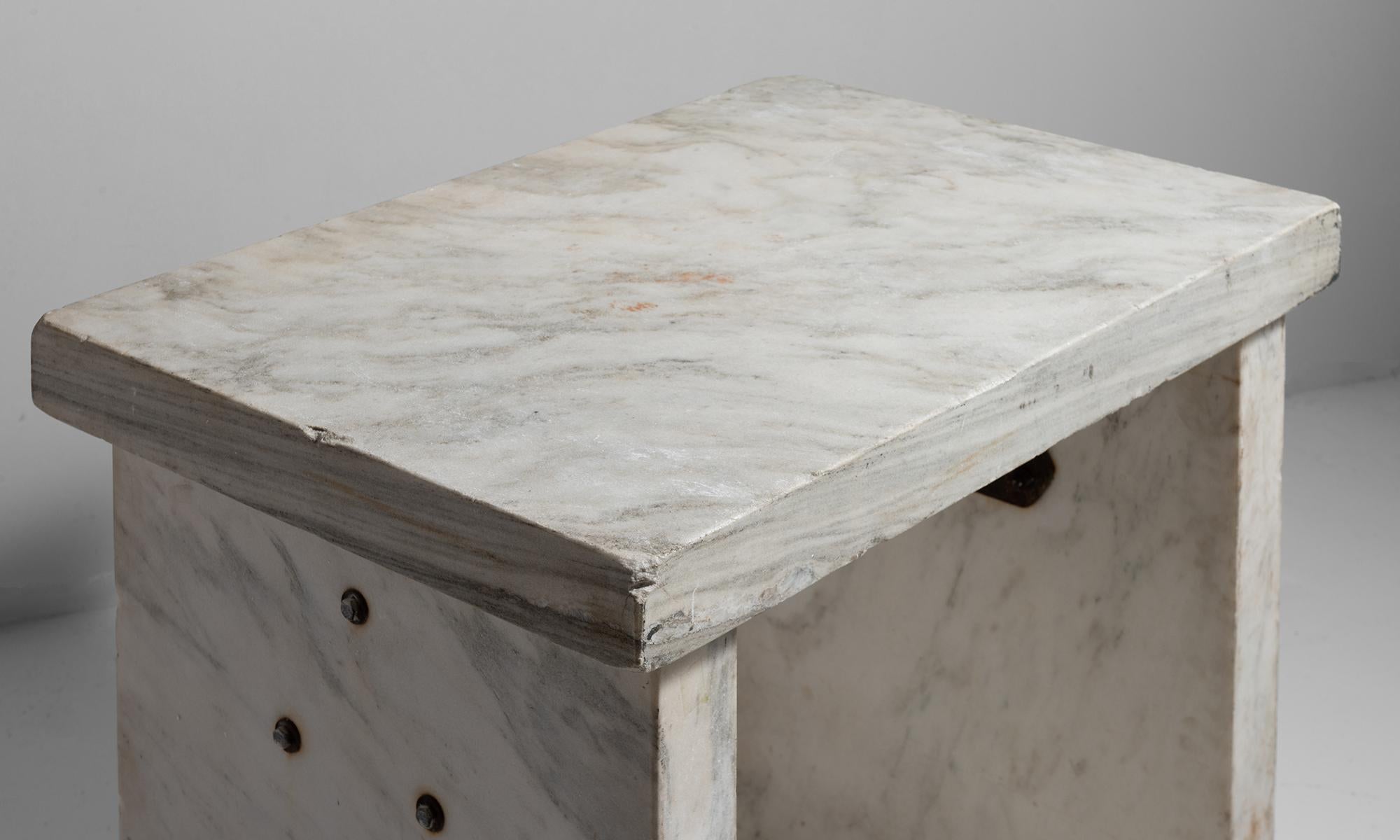 Heavy slabs of marble with metal stretcher. Marble provided the ideal cold surface for bakers to work with dough.

 