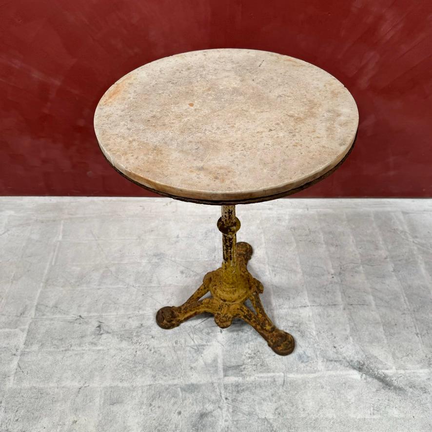 Iron base with yellow patina and dolphin pad feet 
Marble top
Strong and sturdy
French, 1900
