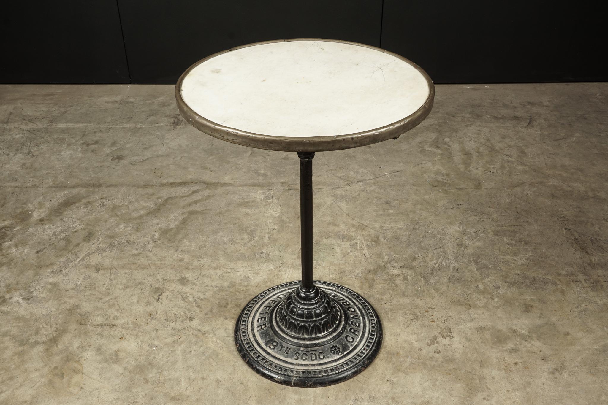 Marble bistro table, France, circa 1930. Original solid marble top with copper edge. Marked 