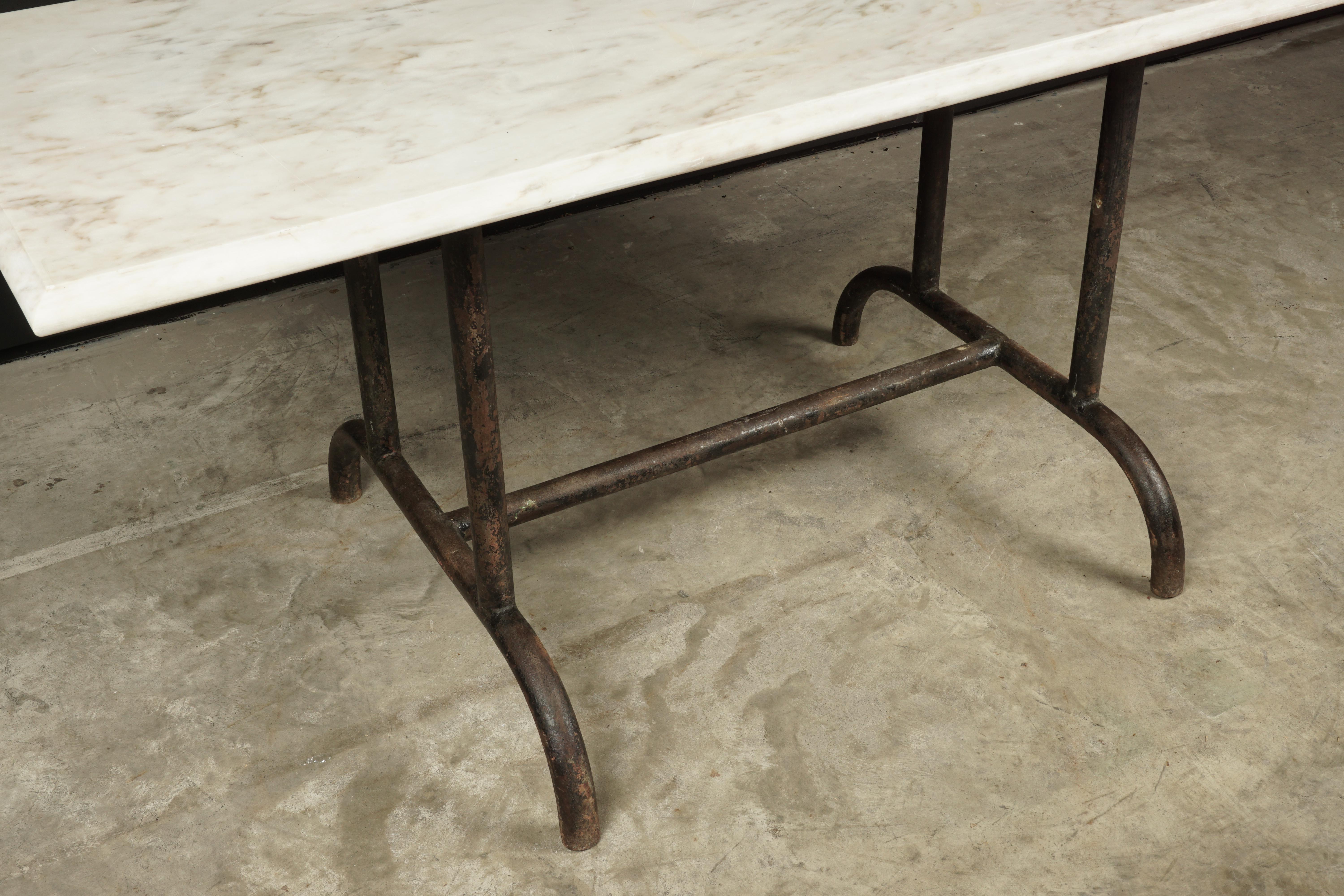 Vintage marble bistro table, France, circa 1930. Iron base with nice patina.