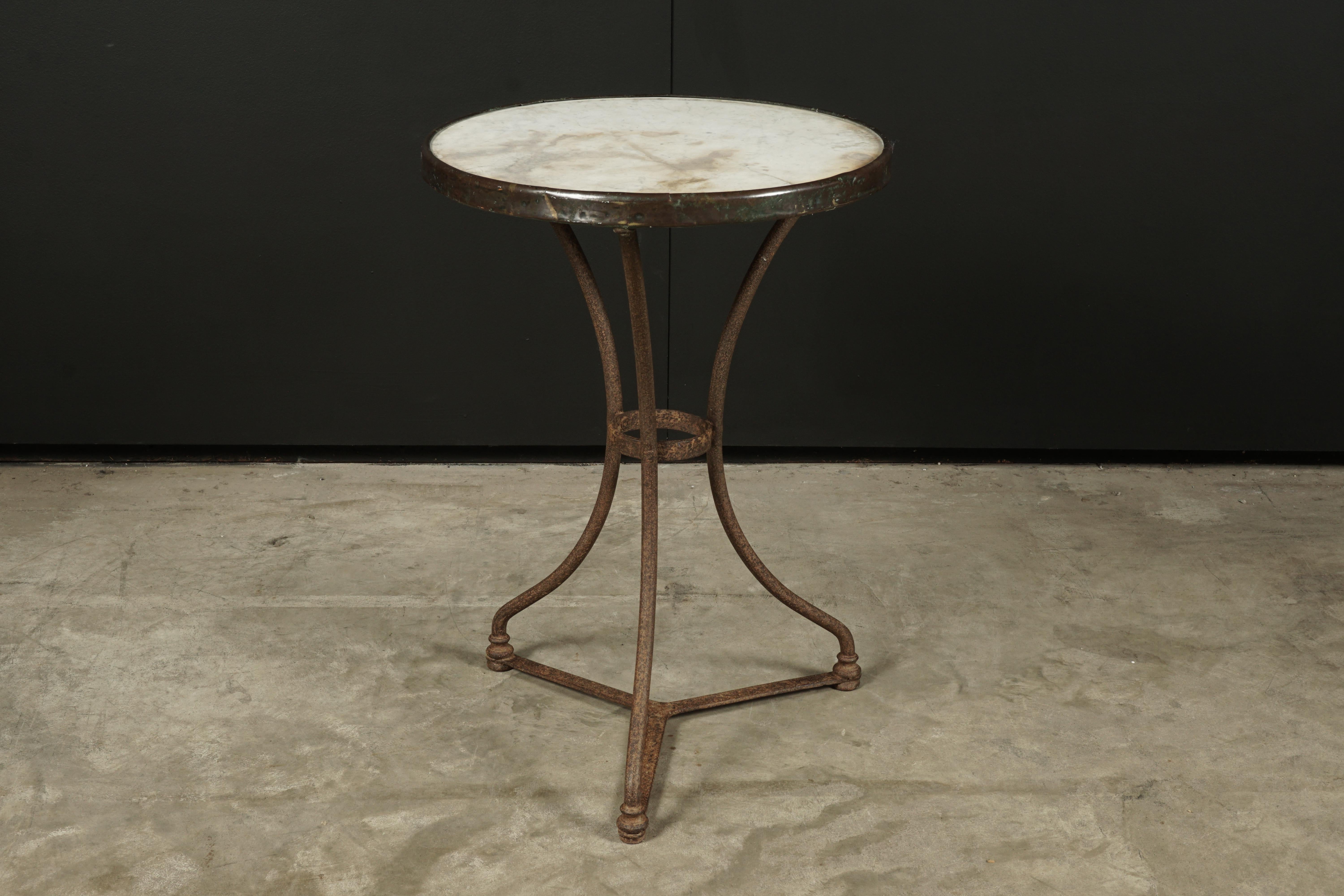 Marble bistro table from France, 1960s. Solid marble top with iron base.