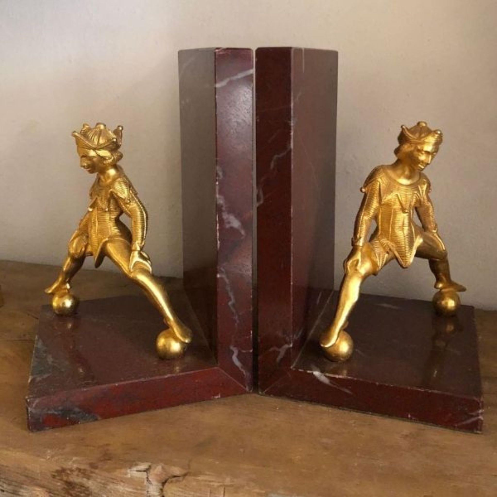 Italian Belle marble bookend with brass jester For Sale